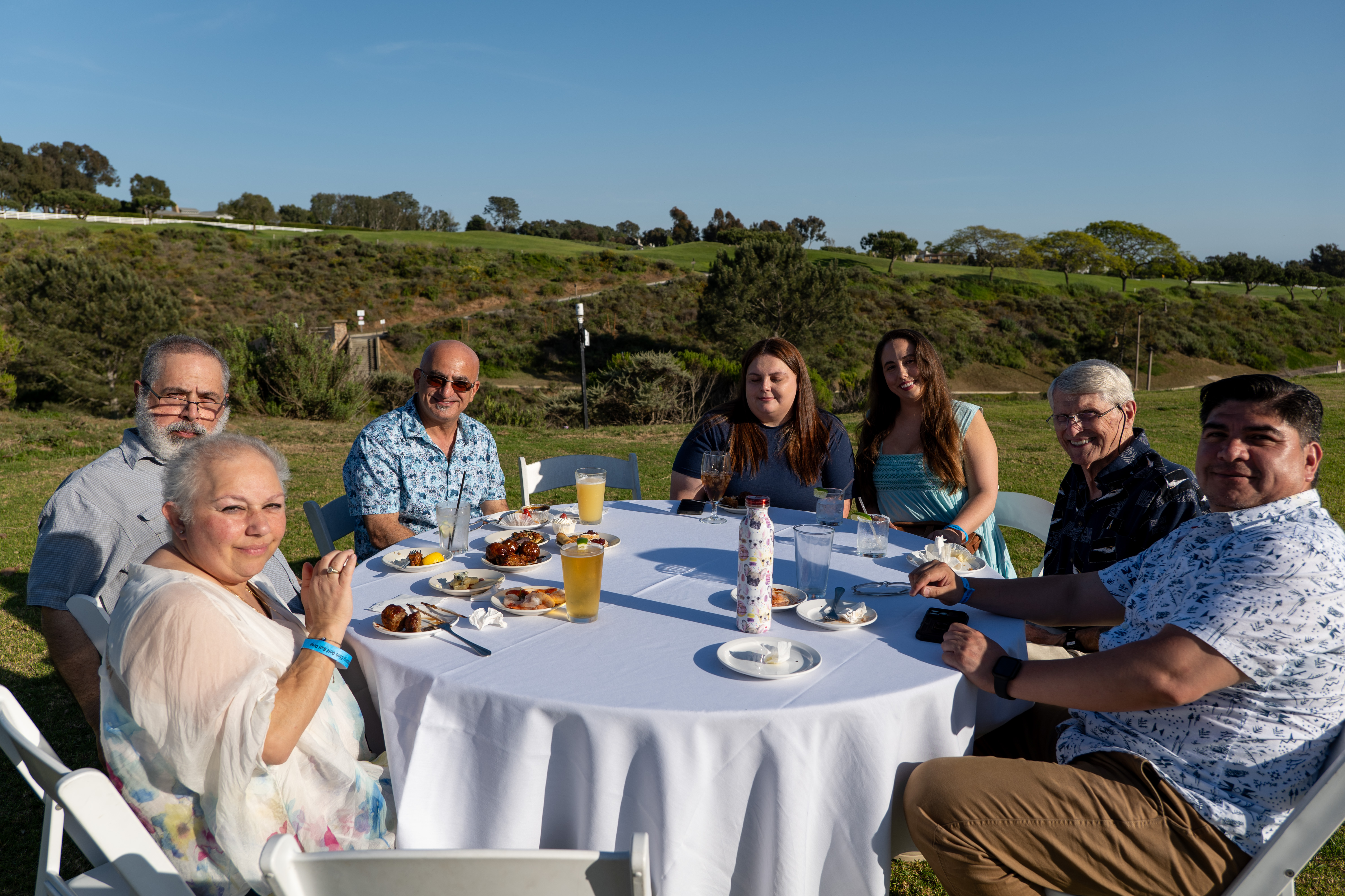 Guests enjoy food, drinks, and conversation during the coastal reception...