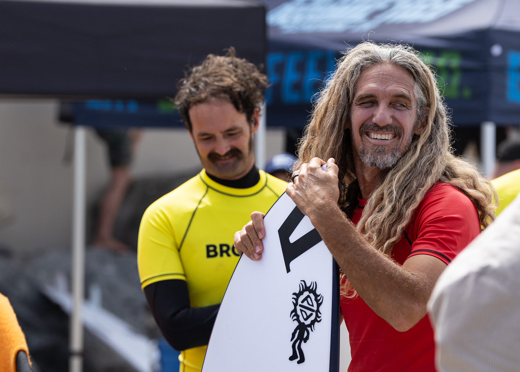 Switchfoot guitarist Boaz Roberts with professional surfer Rob Machado at...