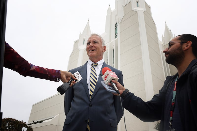 Members of the media speak to Jim Nuckols during media day at the San Diego California Temple on Monday, June 15, 2026.