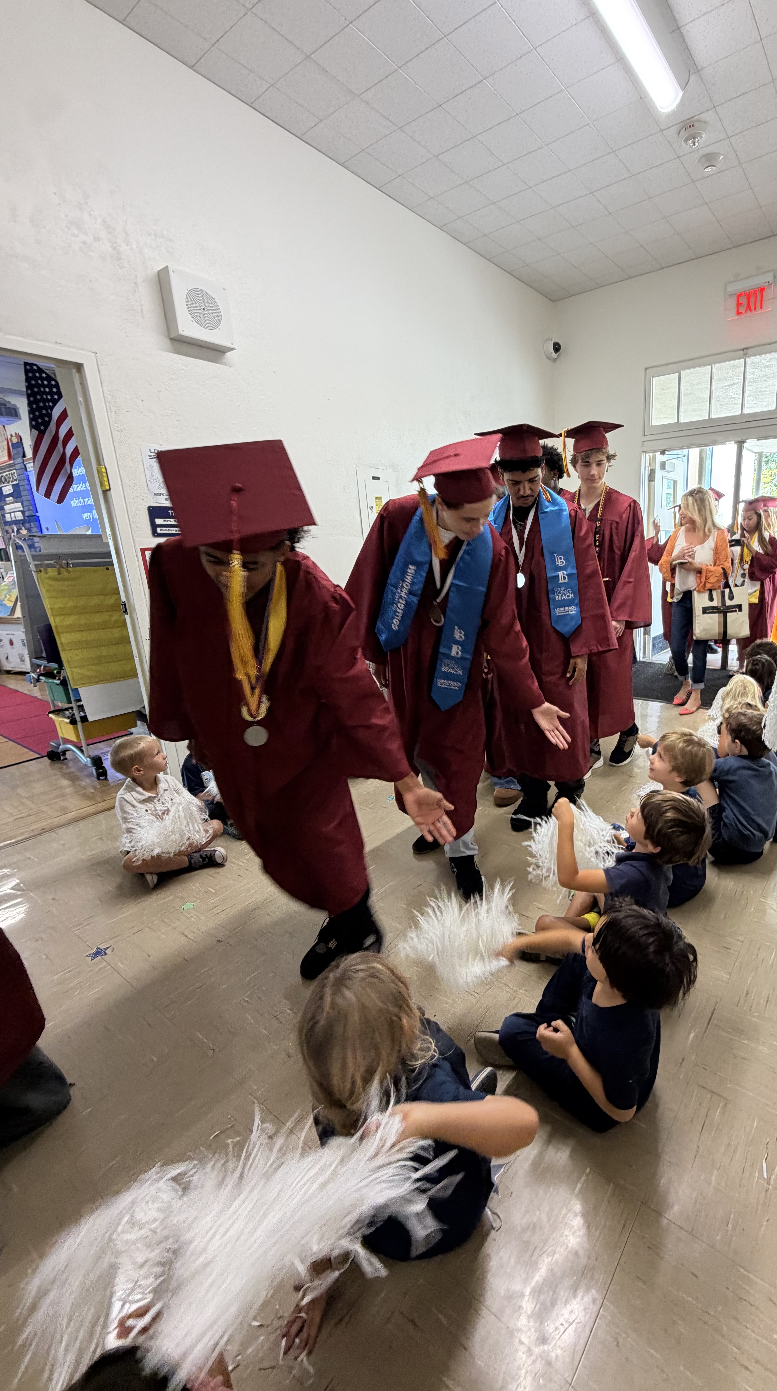 Graduating seniors from the Class of 2026 return to their...