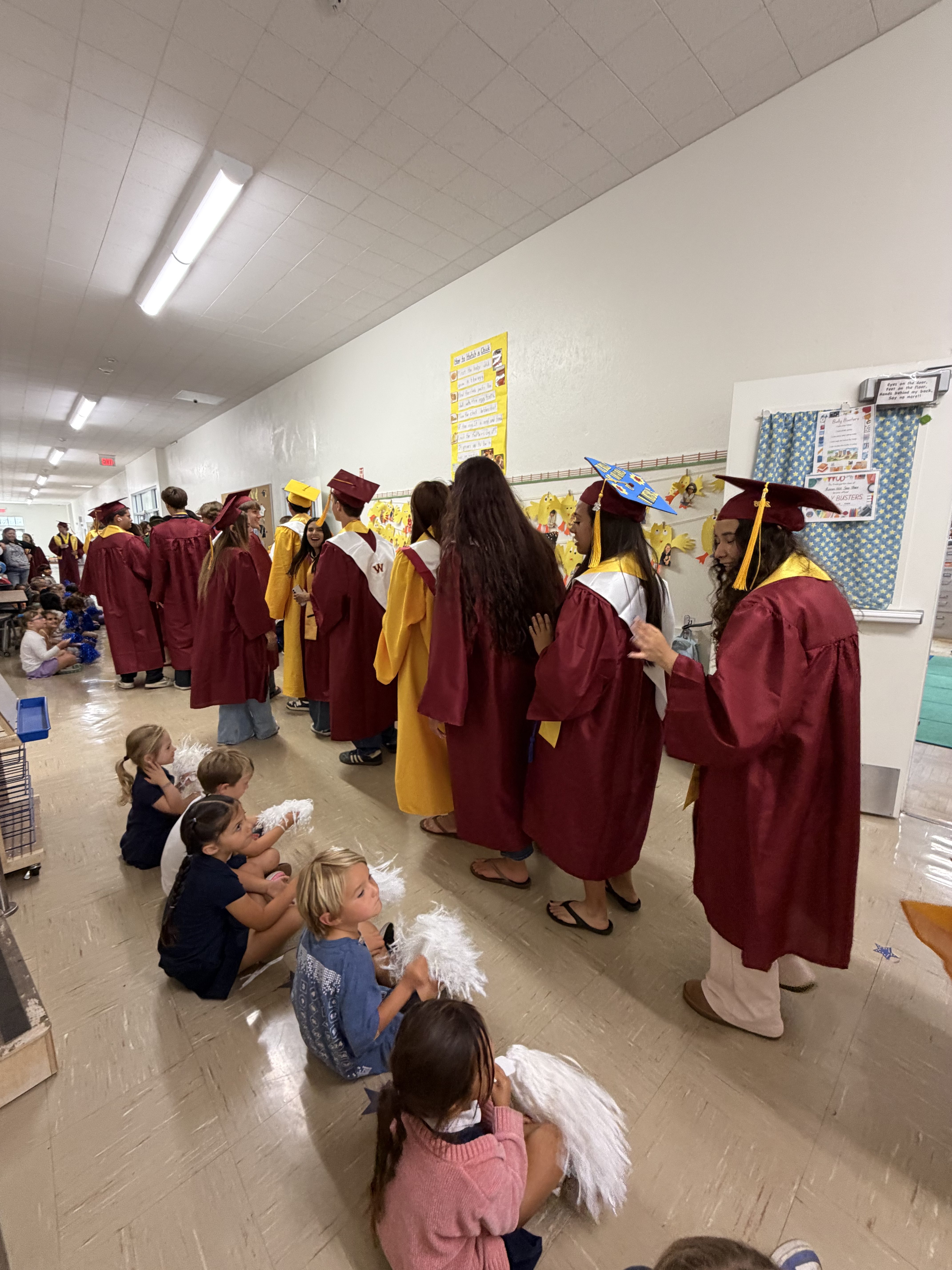 Graduating seniors from the Class of 2026 return to their...
