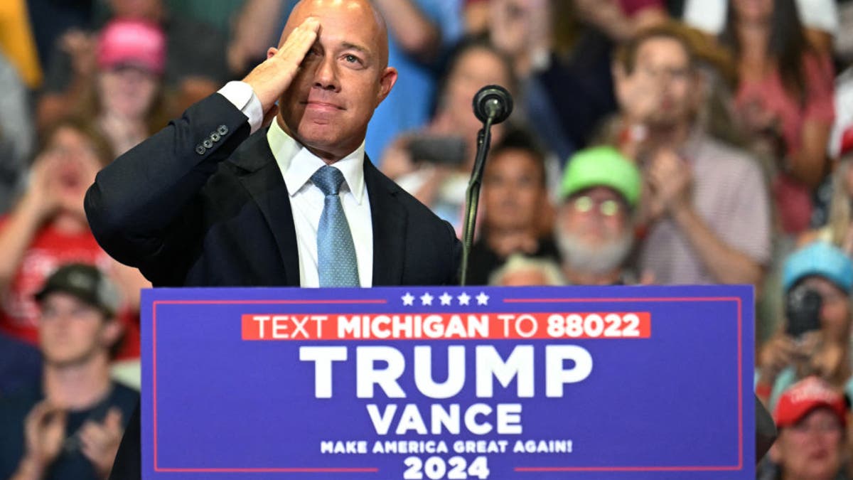 Rep. Brian Mast saluting at a campaign rally in Grand Rapids Michigan