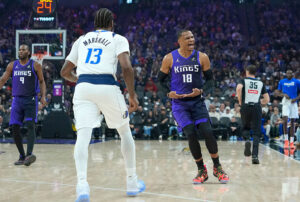 SACRAMENTO, CALIFORNIA - DECEMBER 27: Russell Westbrook #18 of the Sacramento Kings reacts after scoring over Naji Marshall #13 of the Dallas Mavericks in the first half at Golden 1 Center on December 27, 2025 in Sacramento, California. NOTE TO USER: User expressly acknowledges and agrees that, by downloading and or using this photograph, User is consenting to the terms and conditions of the Getty Images License Agreement. (Photo by Thearon W. Henderson/Getty Images)