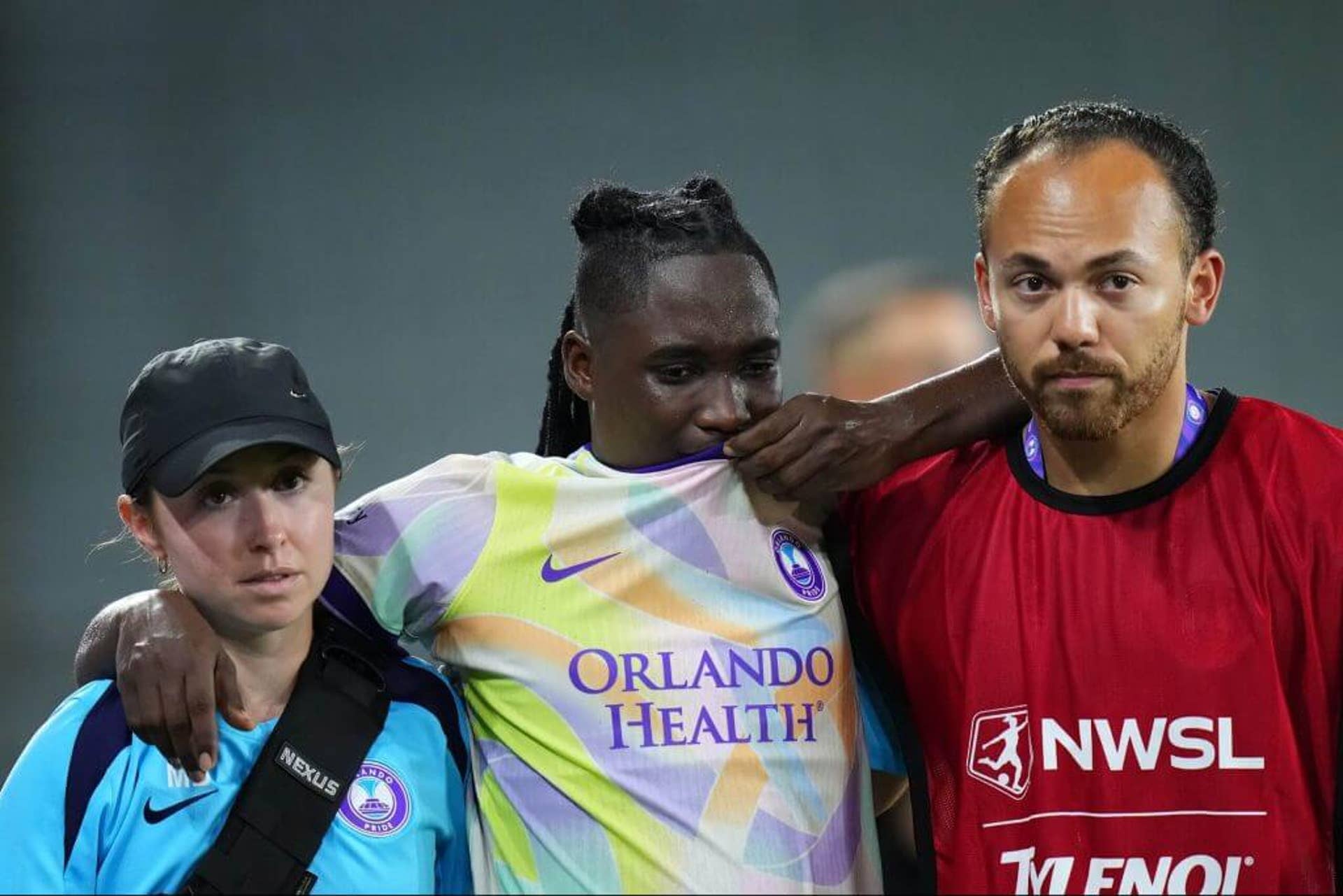 Barbra Banda leaves the pitch with help after suffering an injury against Bay FC.