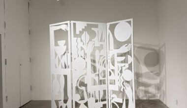 Heavy Metal exhibition installation featuring a white cut-metal sculptural screen casting intricate shadows at LAMAG in Barnsdall Art Park.