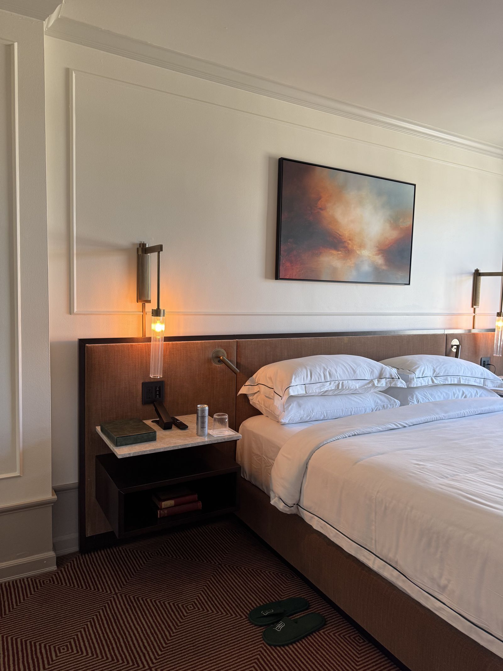 Image may contain Corner Indoors Interior Design Home Decor Book Publication Cushion Bed Furniture and Bedroom