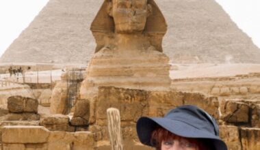 Jacqi Bowe standing in front of the Great Sphinx and Pyramid of Giza for Hashtag What I Did on My Summer Fake-Cation