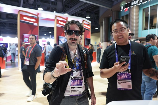 One man wore the new Aura glasses at the Qualcomm booth during the conference (Augmented World Expo)