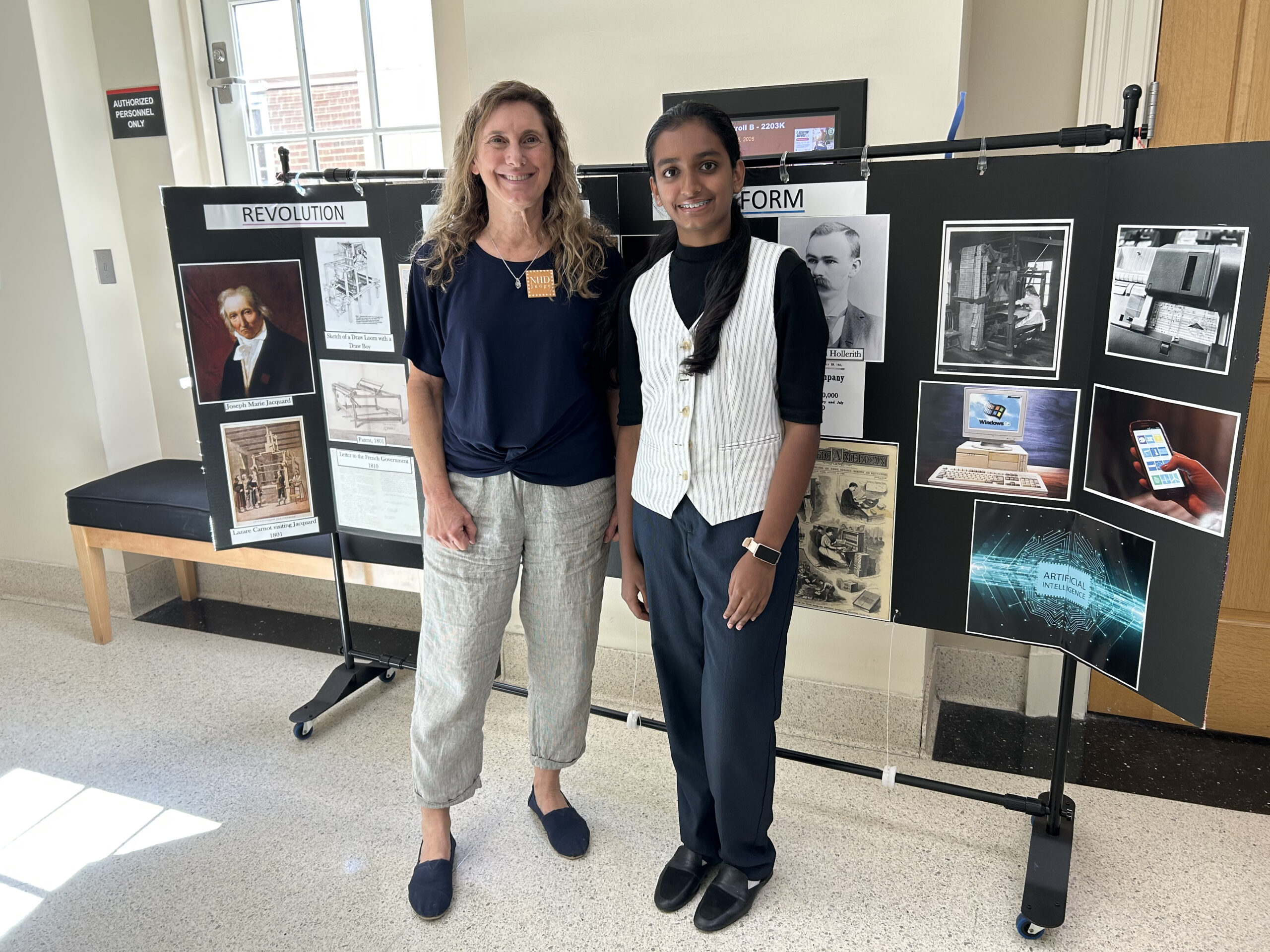 OCDE National History Day-Orange County Coordinator Julie Hull, left, poses with Sierra Vista Middle School student Aria Yatavelli and her project at the 2026 National History Day National Contest at the University of Maryland.