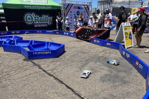 Youngsters had an opportunity to race cars in the Kids Zone. (Kirk Kenney / San Diego Union-Tribune)