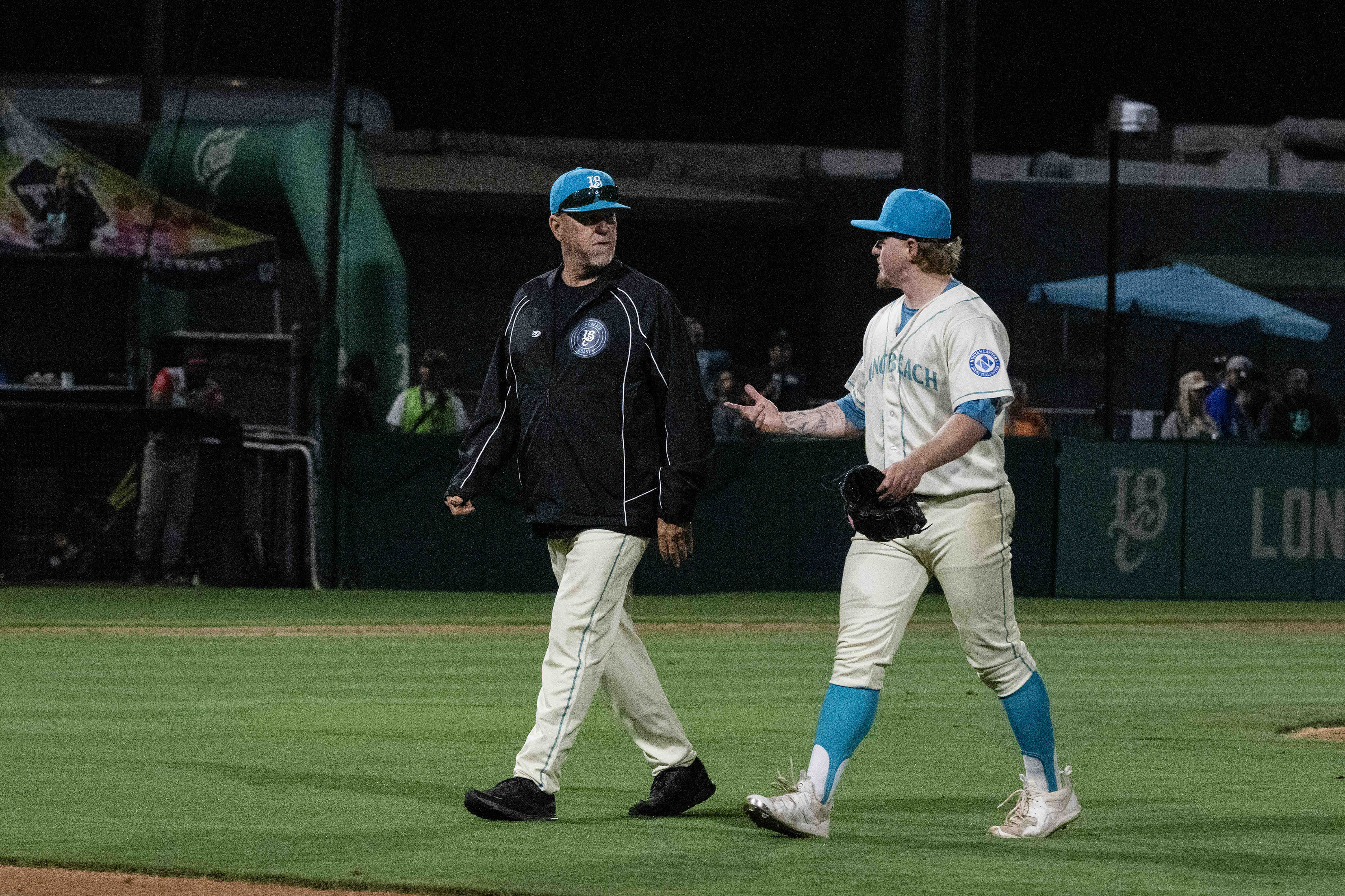 Manager Troy Percival, left, and the Long Beach Coast compete...