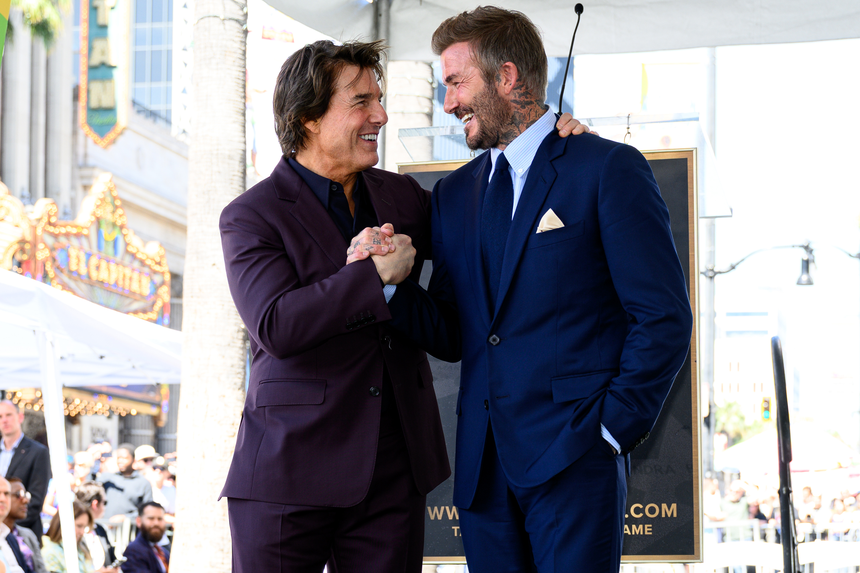 Tom Cruise poses with David Beckham at his Hollywood Walk...