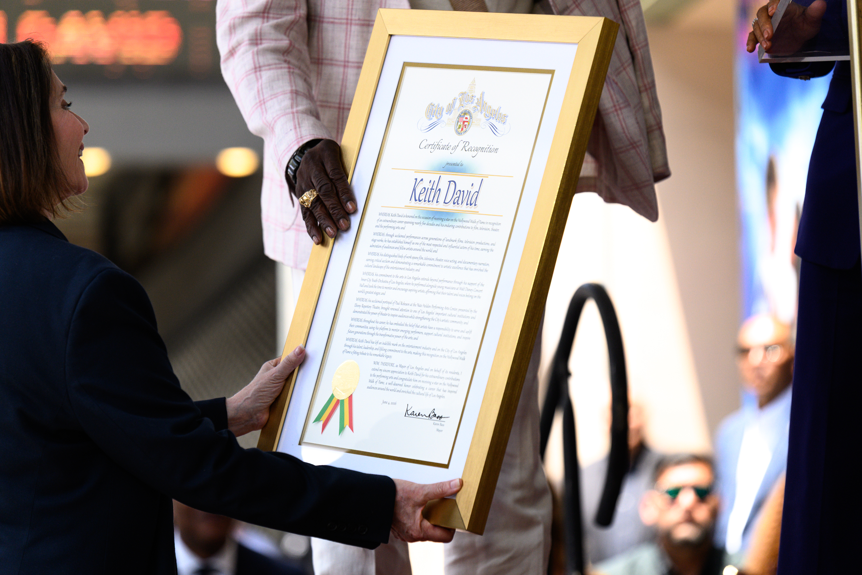 Hollywood Walk of Fame producer Ana Martinez hands Keith David...