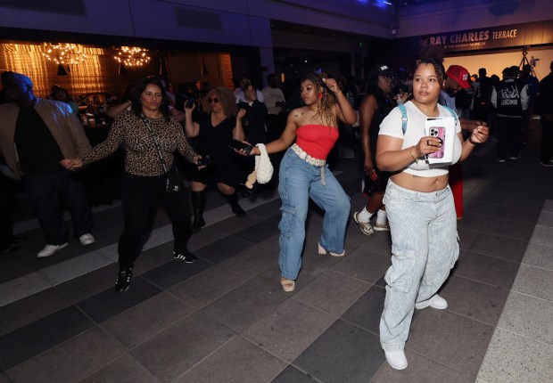 Guests dance during The GRAMMY Museum hip-hop block party at GRAMMY Museum L.A. Live on June 05, 2025 in Los Angeles, California. The block party returns June 16. (Photo by Randy Shropshire/Getty Images for The Recording Academy)