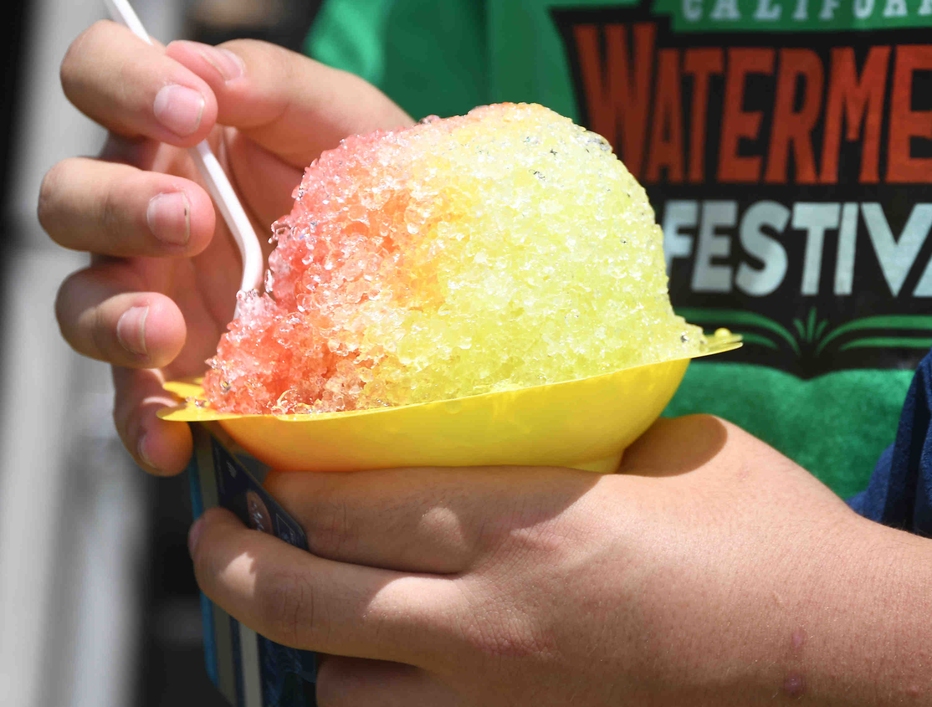 People enjoy watermelon flavor shave ice during the California watermelon...