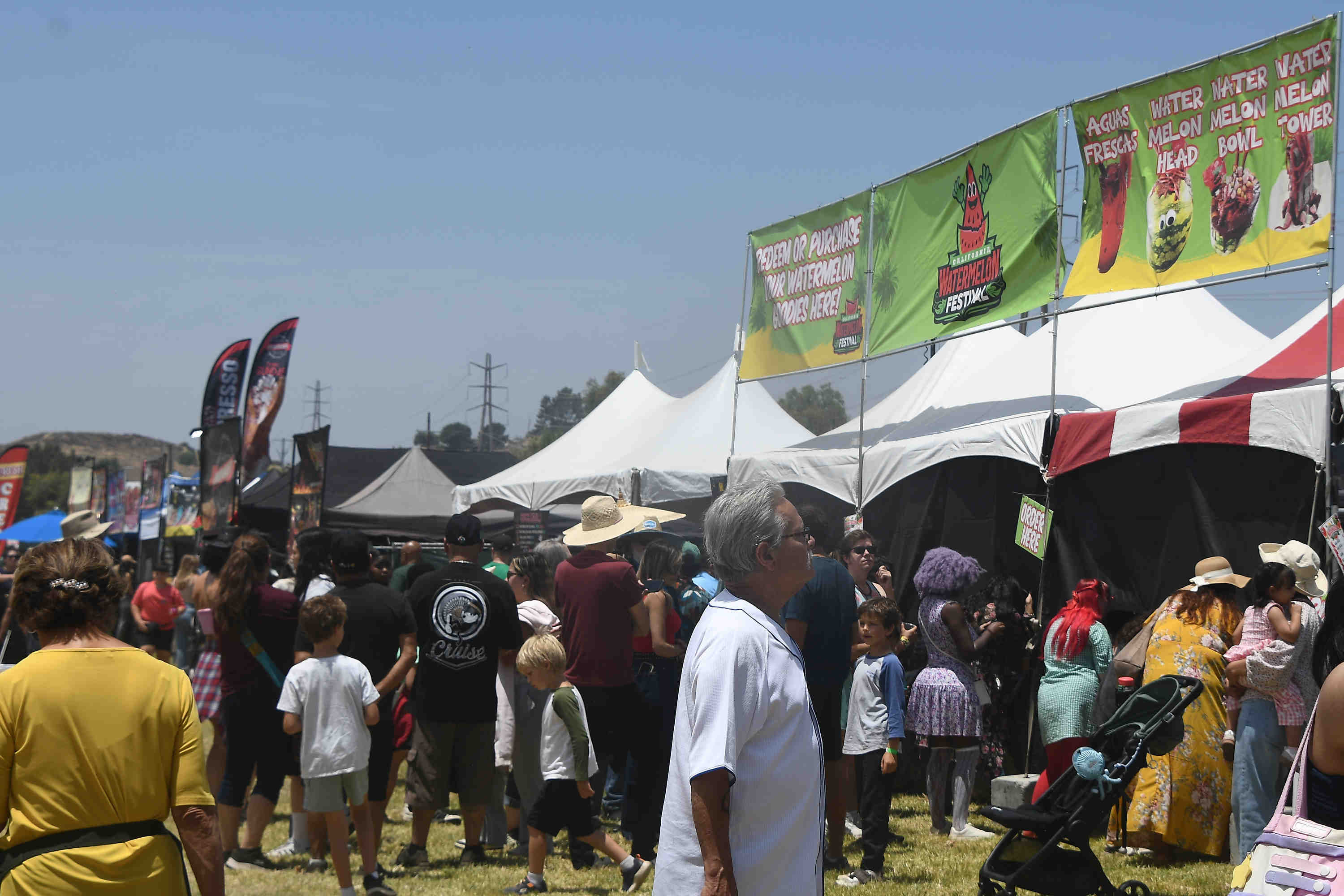 People lineup for different kinds of watermelon foods during the...