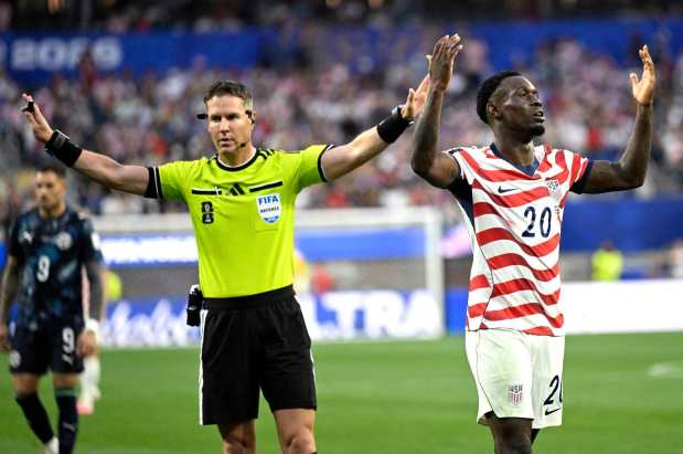 Dutch referee Danny Makkelei refutes a call for a foul by U.S. forward Folarin Balogun in their World Cup opener against Paraguay on Friday night. (Photo by Will Lester, Inland Valley Daily Bulletin/SCNG)