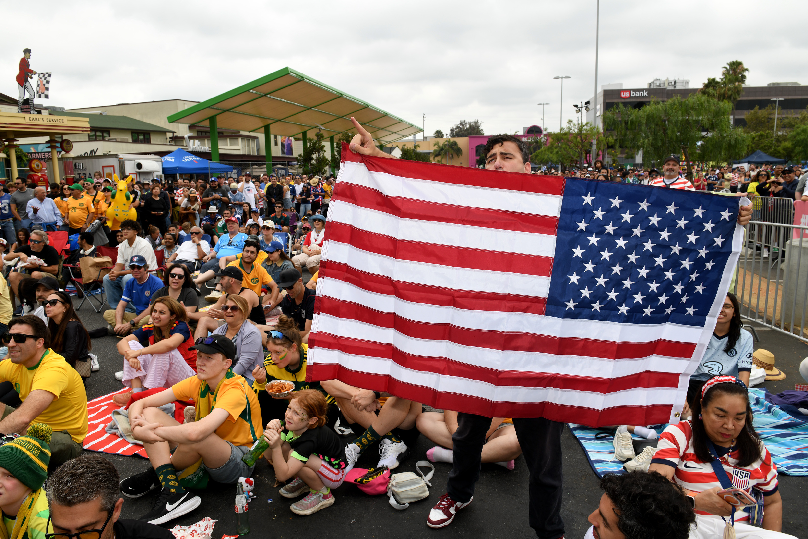 Soccer fans cheer their team as the US takes on...