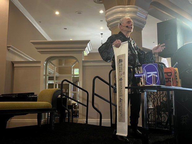 Bill Dubey's performance included props and colored signs indicating which character he was playing at the time. (Noah Lyons)
