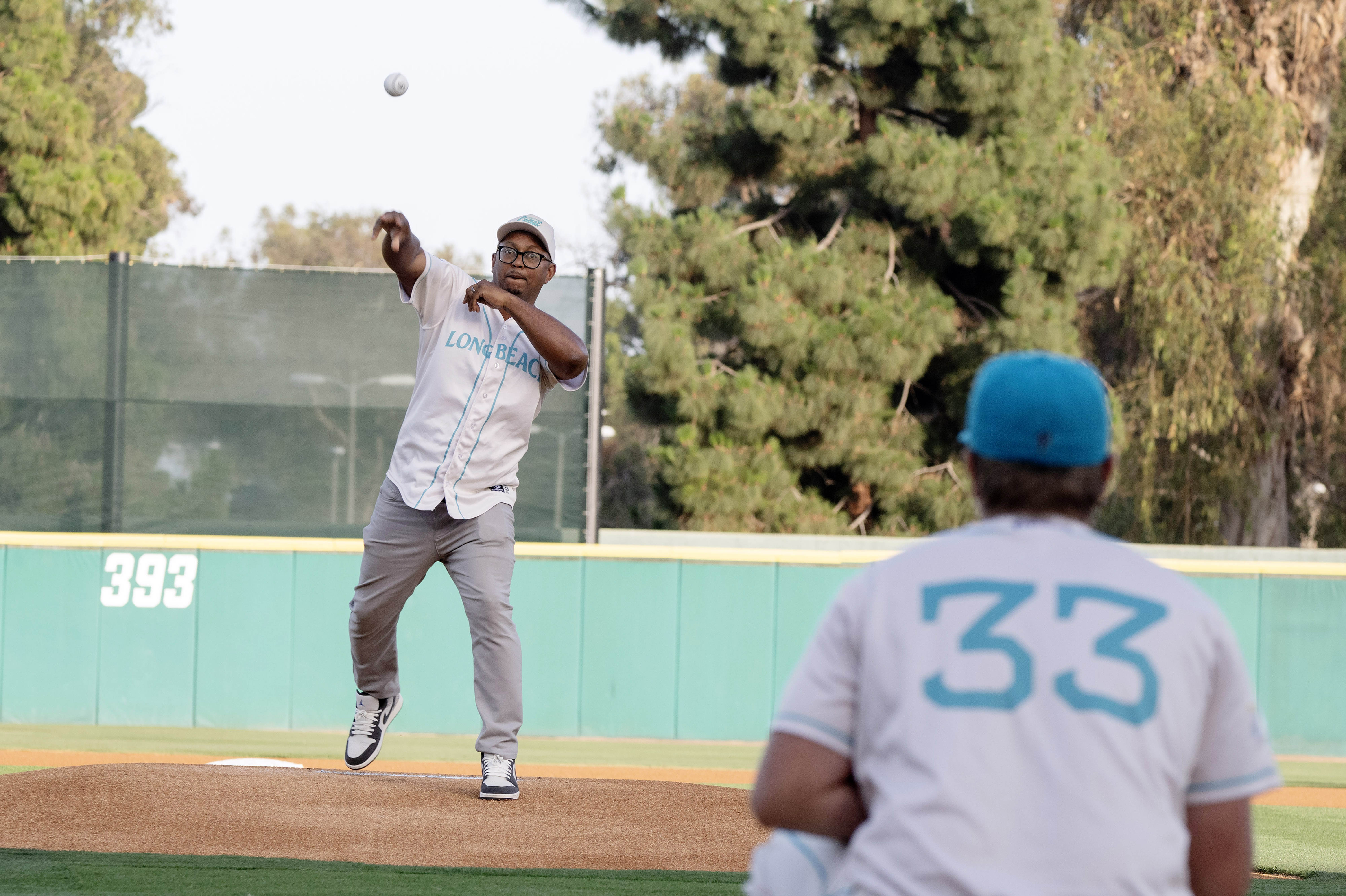 Mayor Rex Richardson throws the ceremonial first pitch during the...