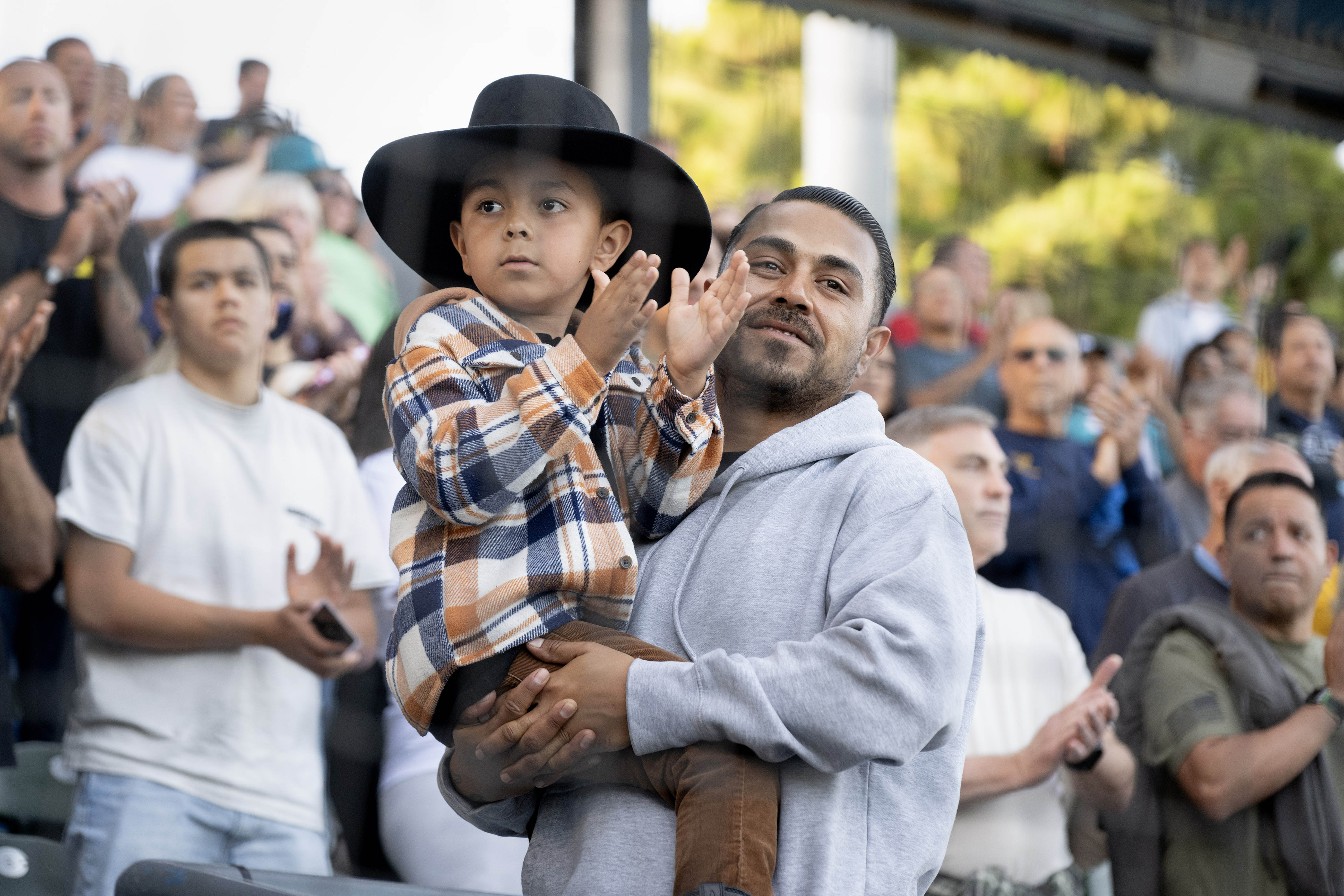 From left, six-year-old Atlas Dillinger and Jon Dillinger attend Long...
