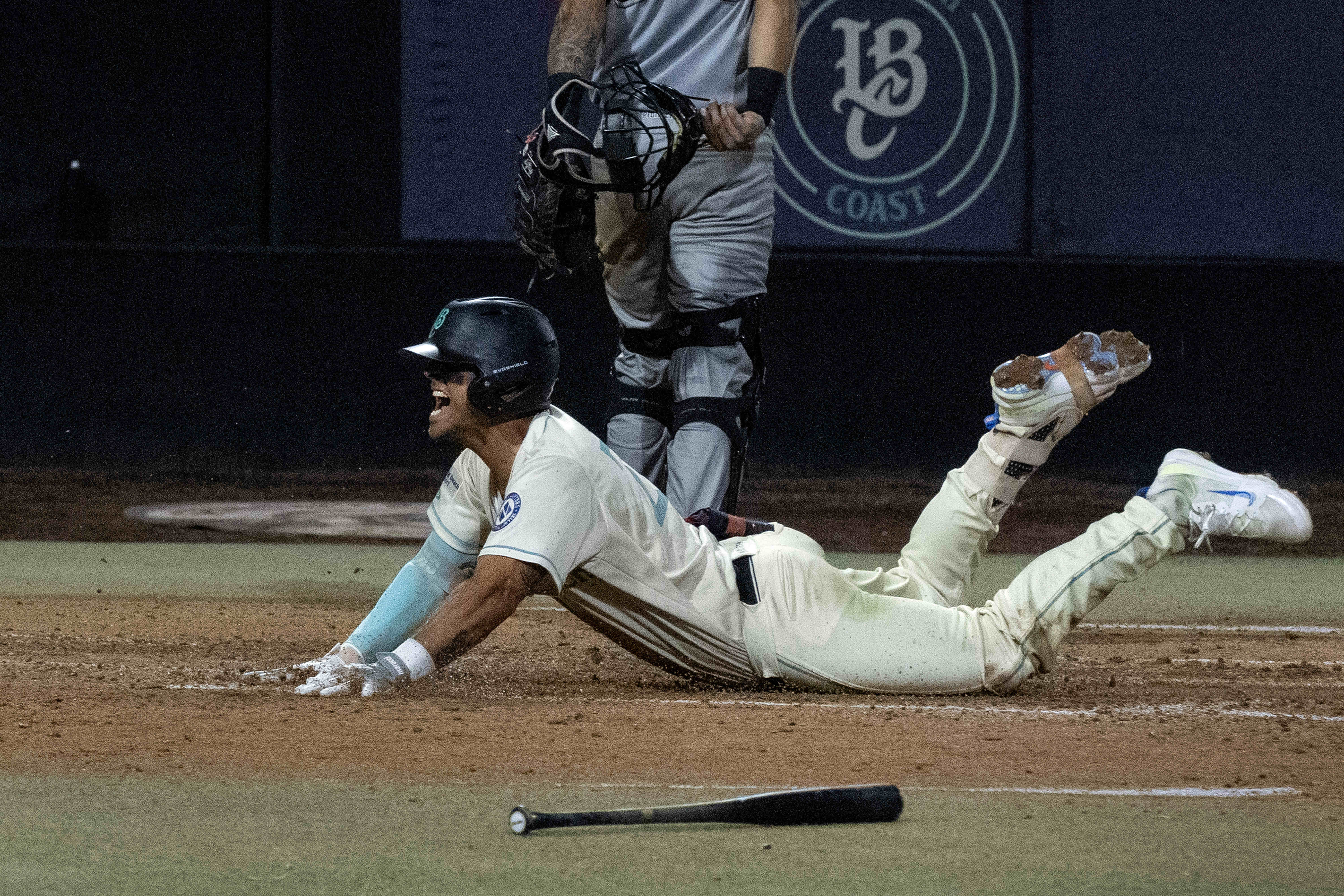 Long Beach Coastâs Jacob Jablonski scores against the RedPocket Mobiles...
