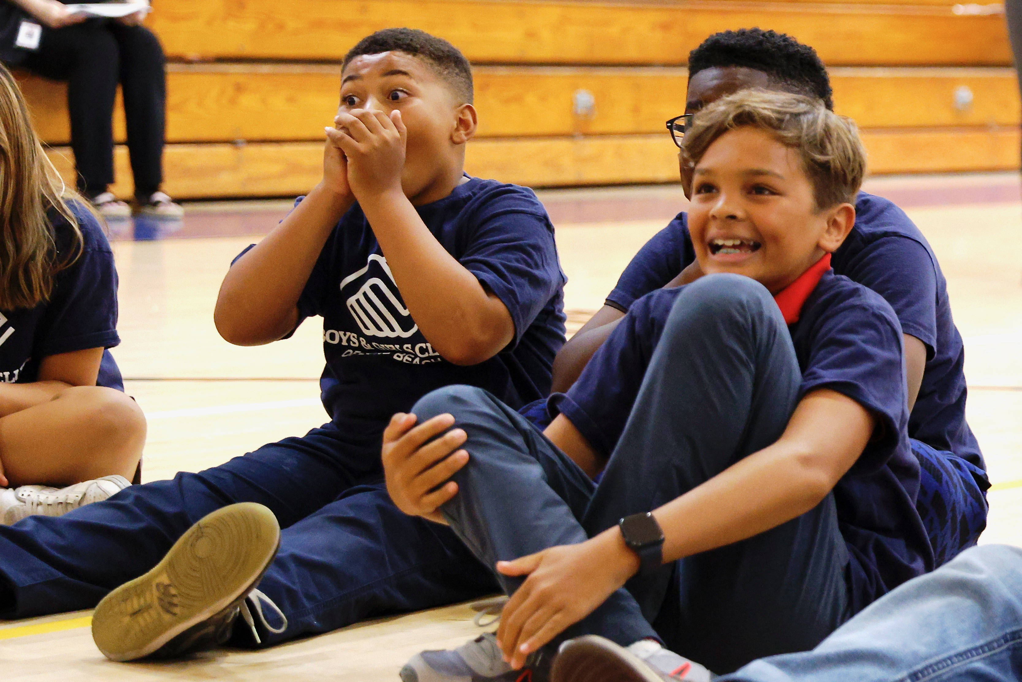 Boys & Girls Club members react on Monday, June 8,...