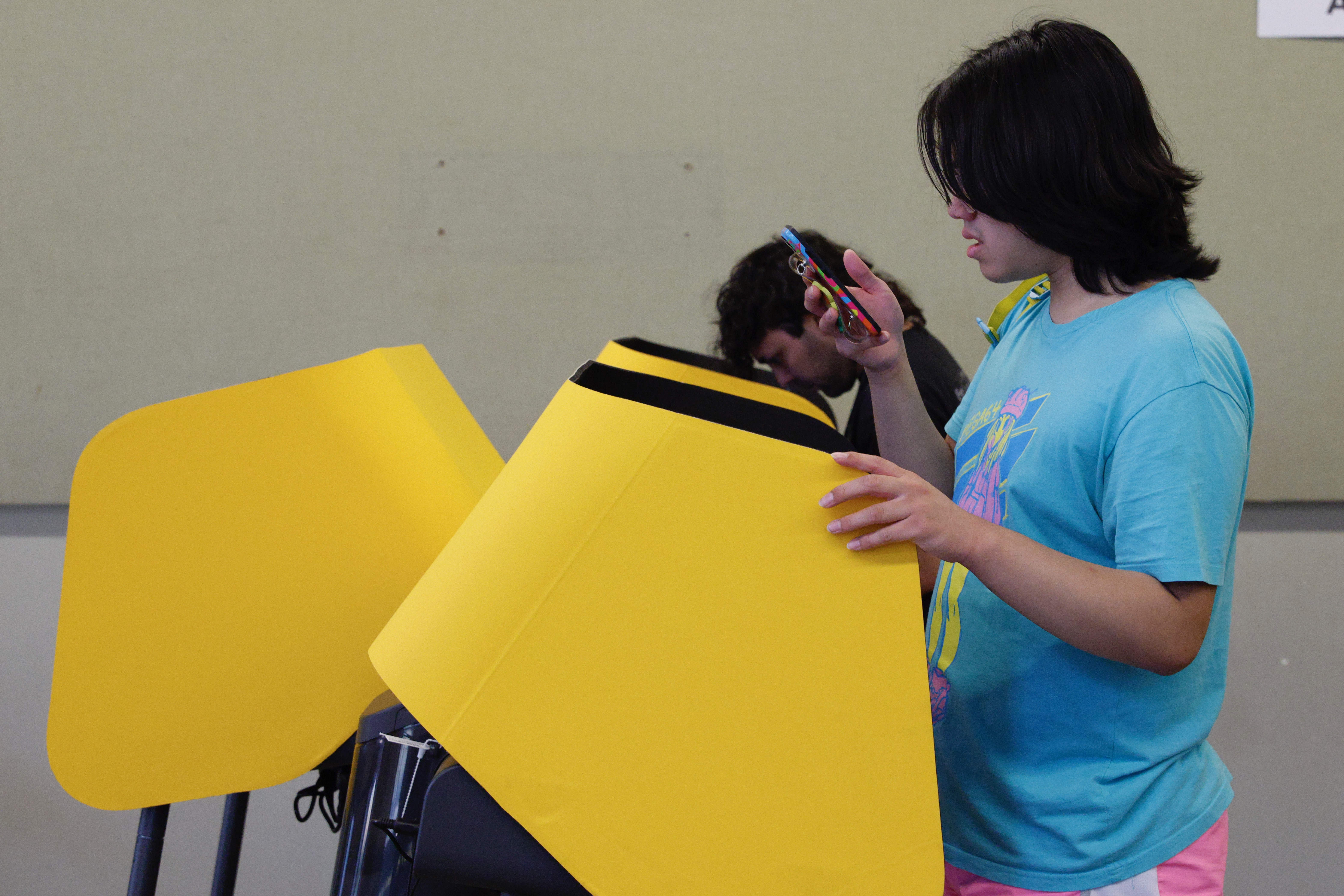 Voters cast their primary election ballots on Tuesday, June 2,...