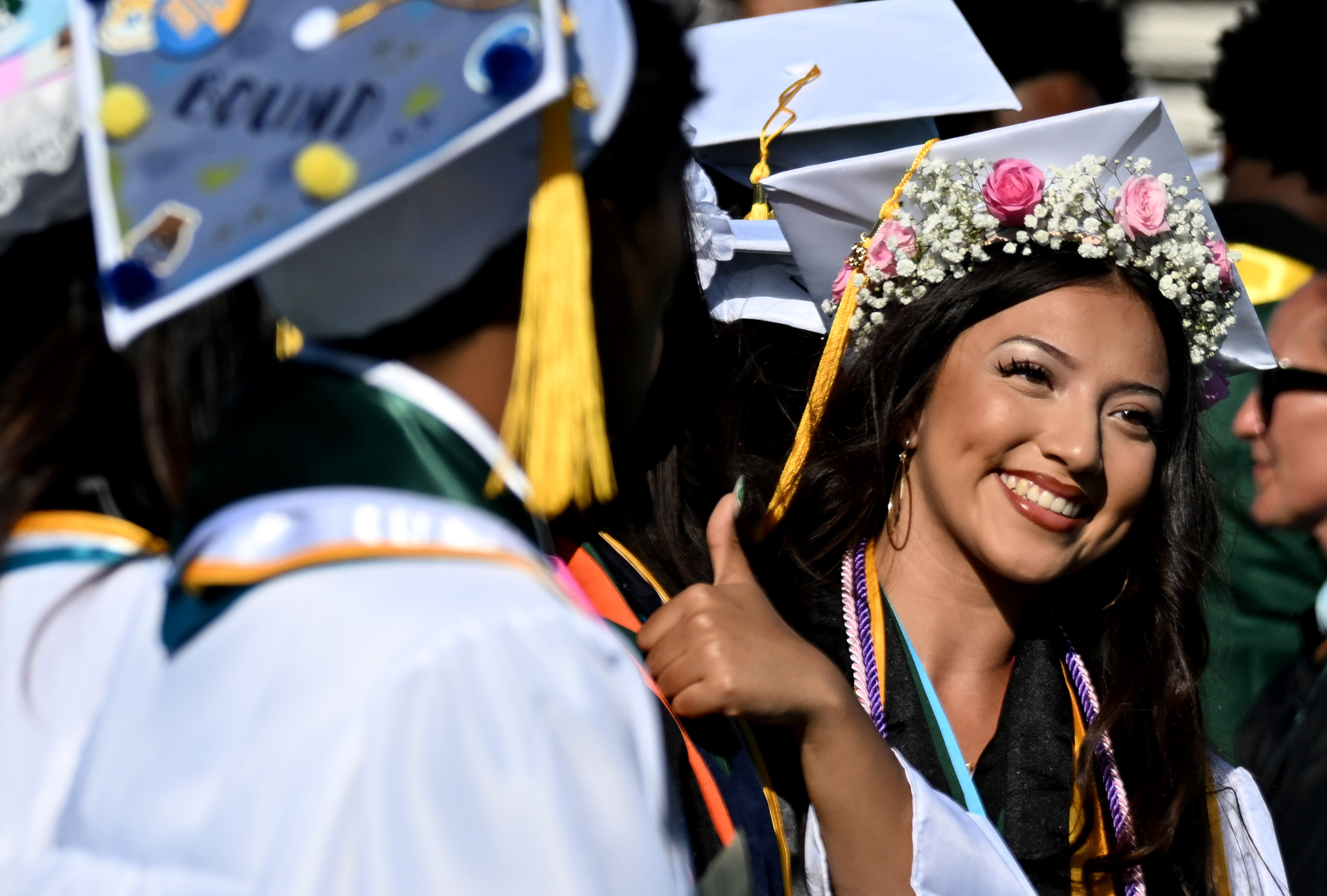 A senior smiles during the 2026 Cabrillo High School Graduation...