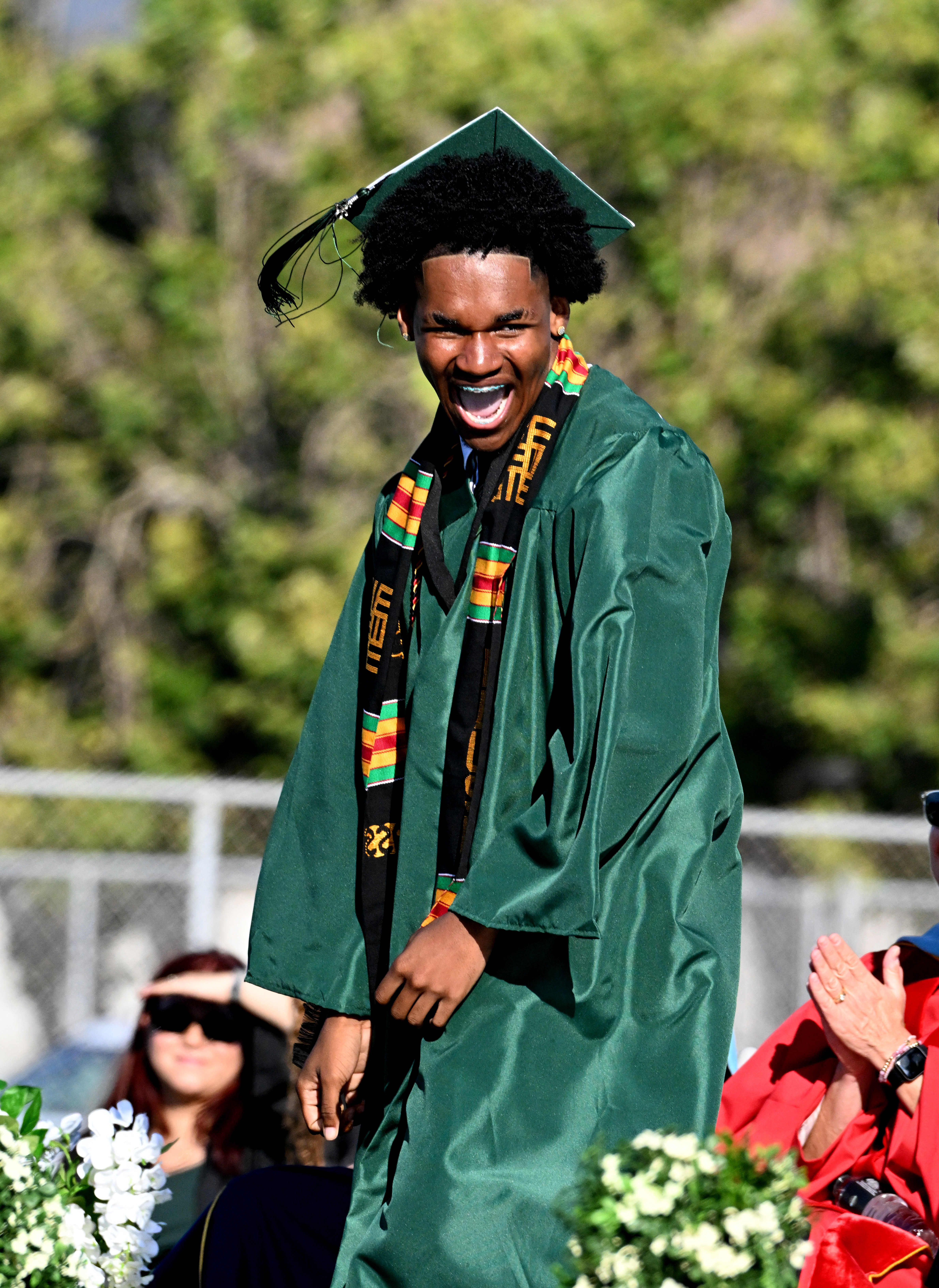Emcee Sebastian Eleby-Thomas dances as he comes up on stage...