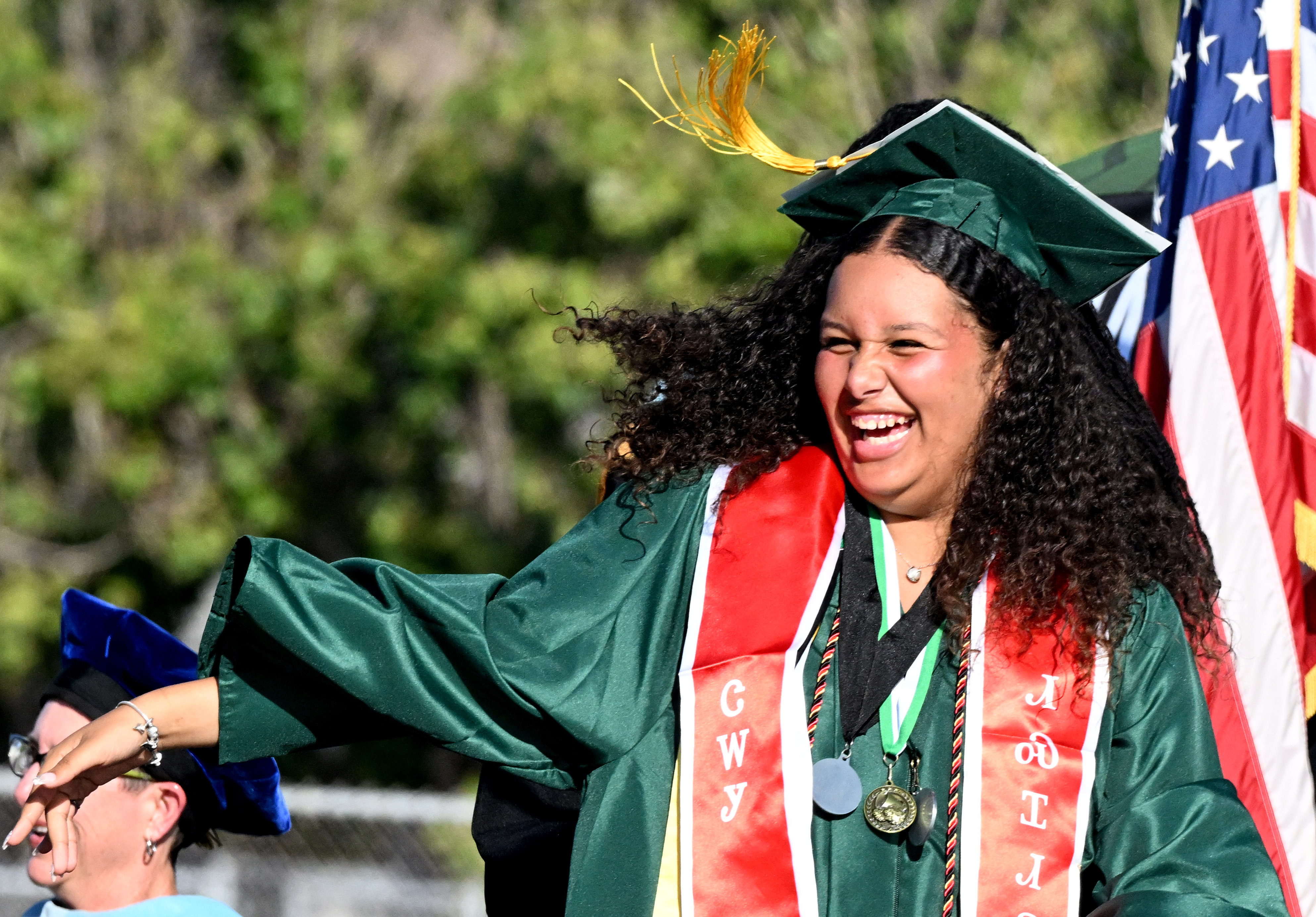 Emcee Malinda Olmedo Pendleton smiles as she comes up on...