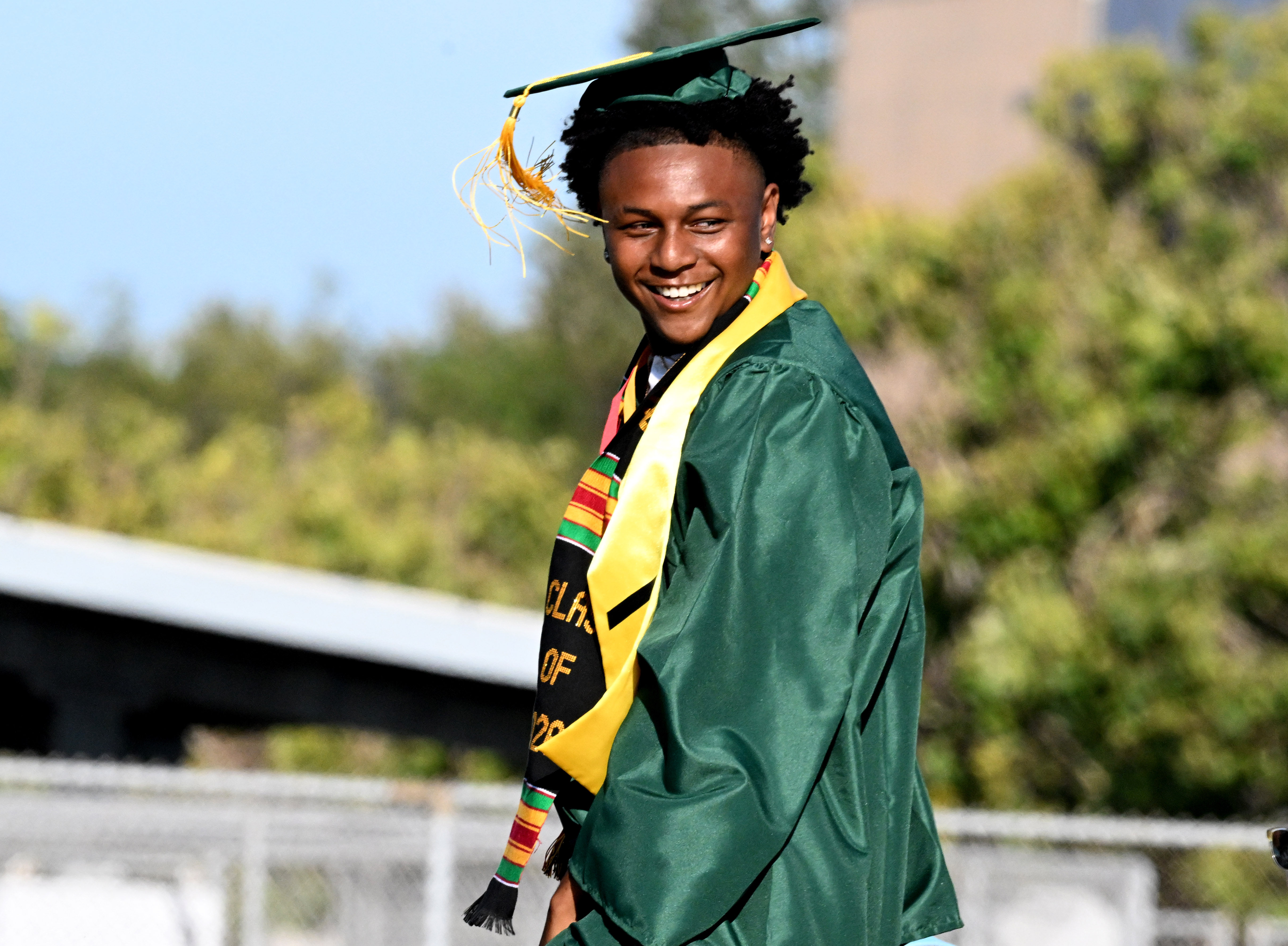 Emcee Marques Reed II dances as he comes up on...