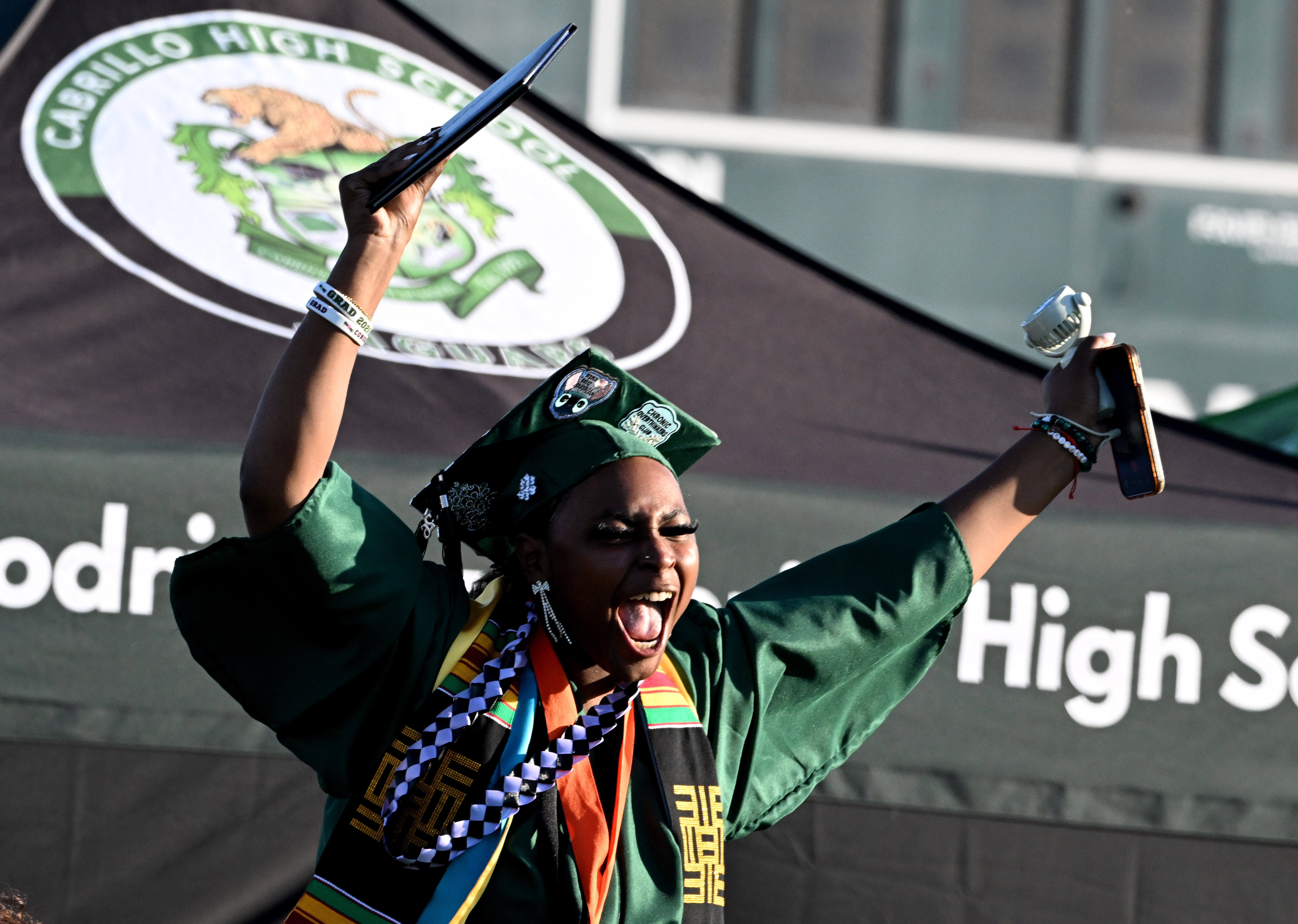 A senior reacts after receiving her diploma during the 2026...