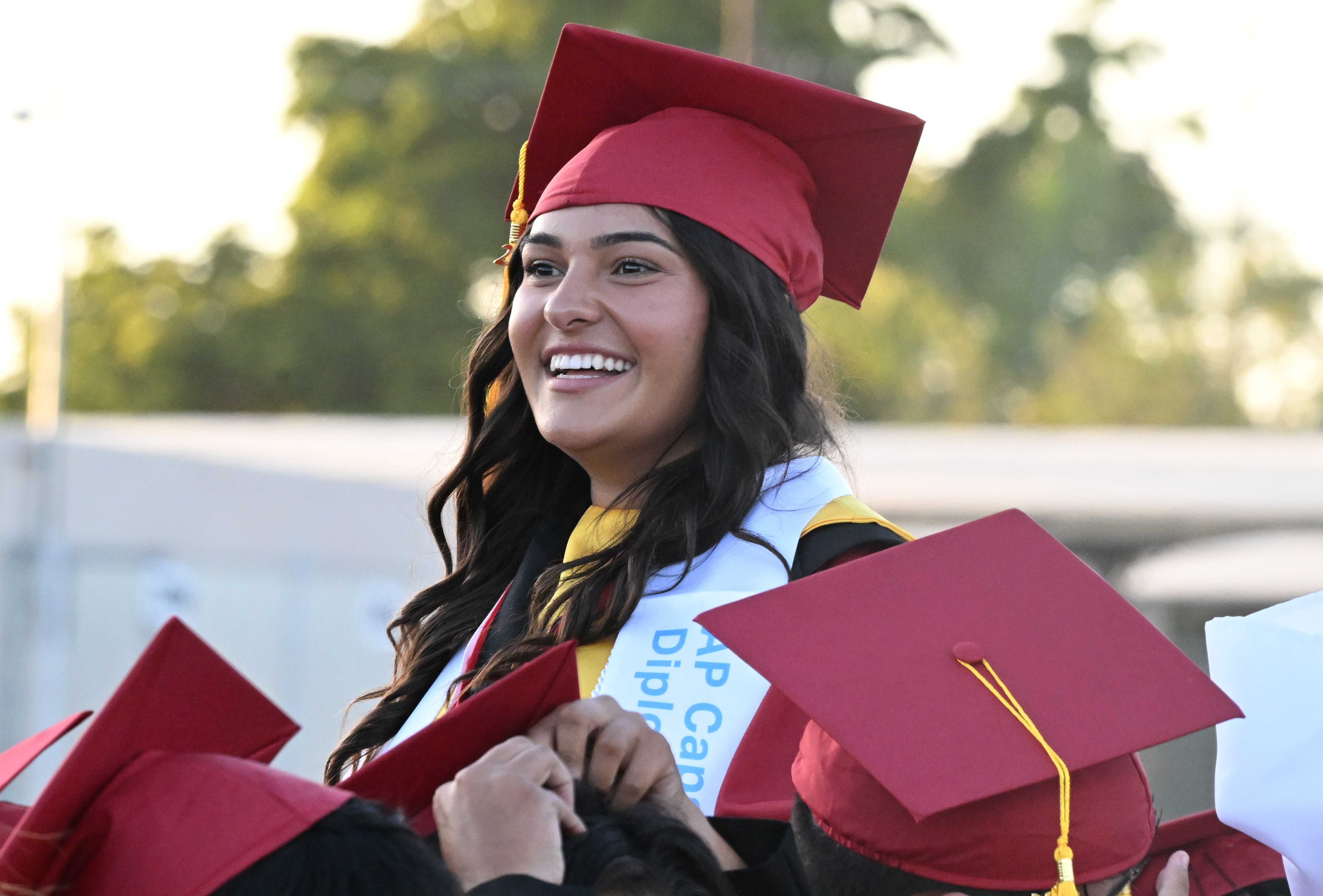 A senior smiles during the 2026 Lakewood High School Graduation...