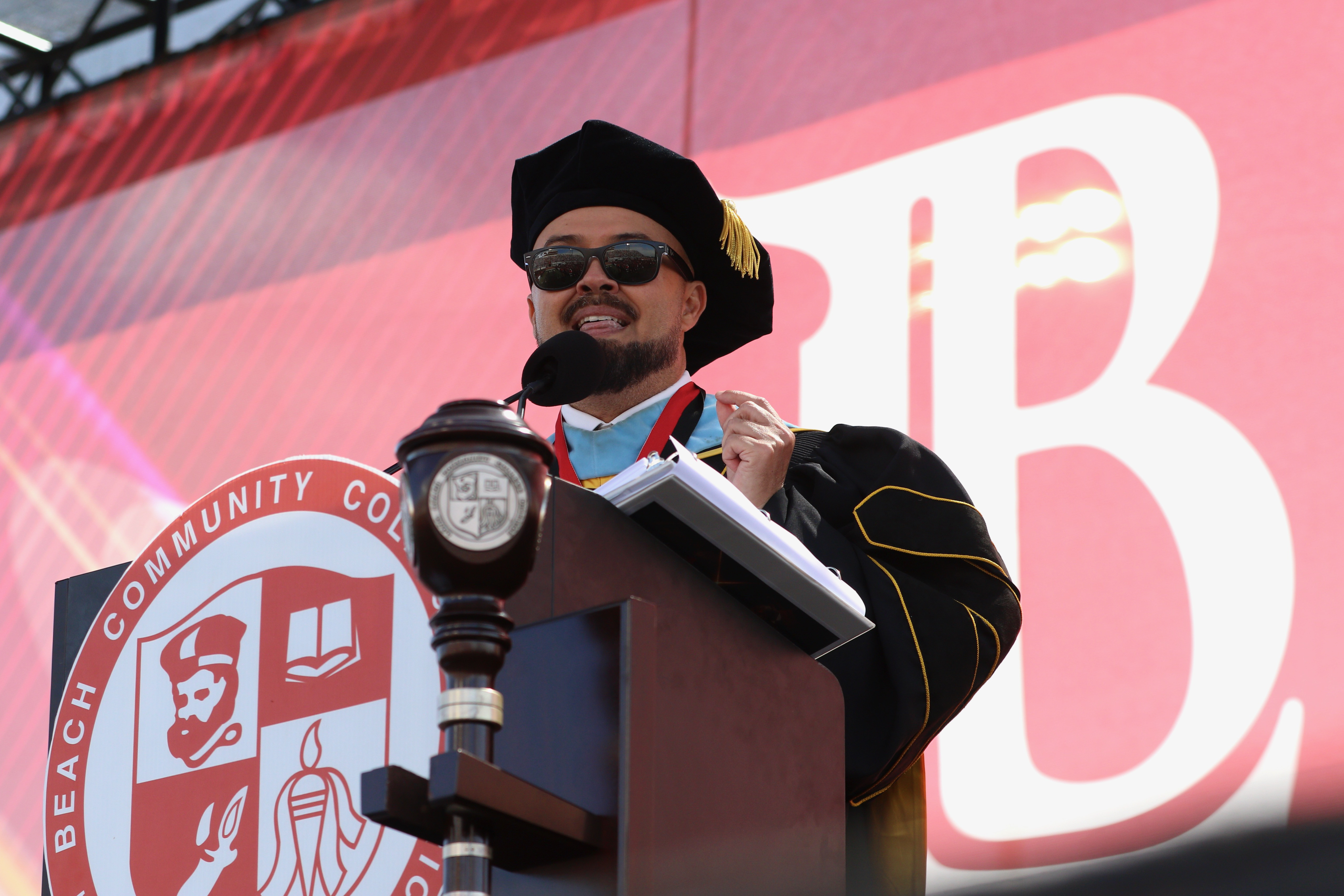 School superintendent and president Mike Munoz addresses graduates at Long...