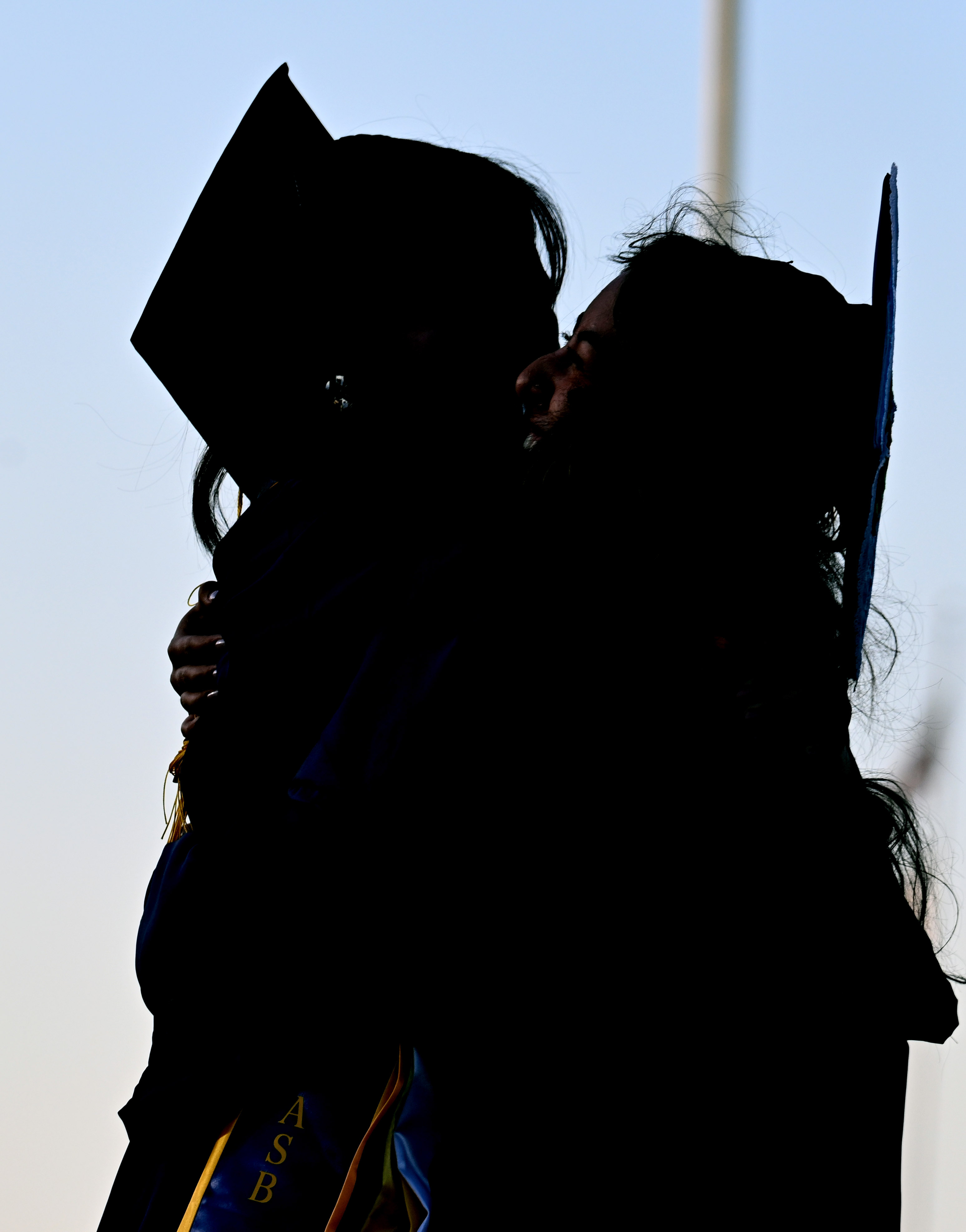 Seniors Stephanie Chau and Lily Fujita embrace after being named...
