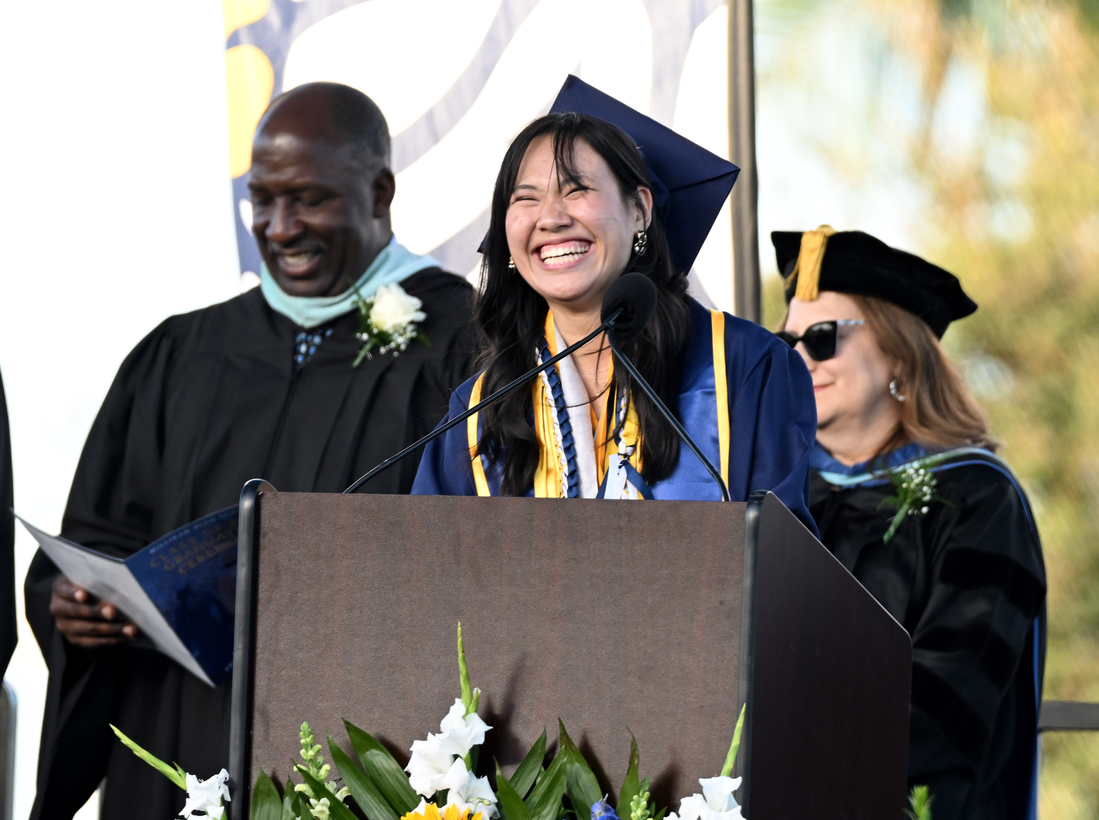 ASB President Stephanie Chau welcomes the guests and graduates during...