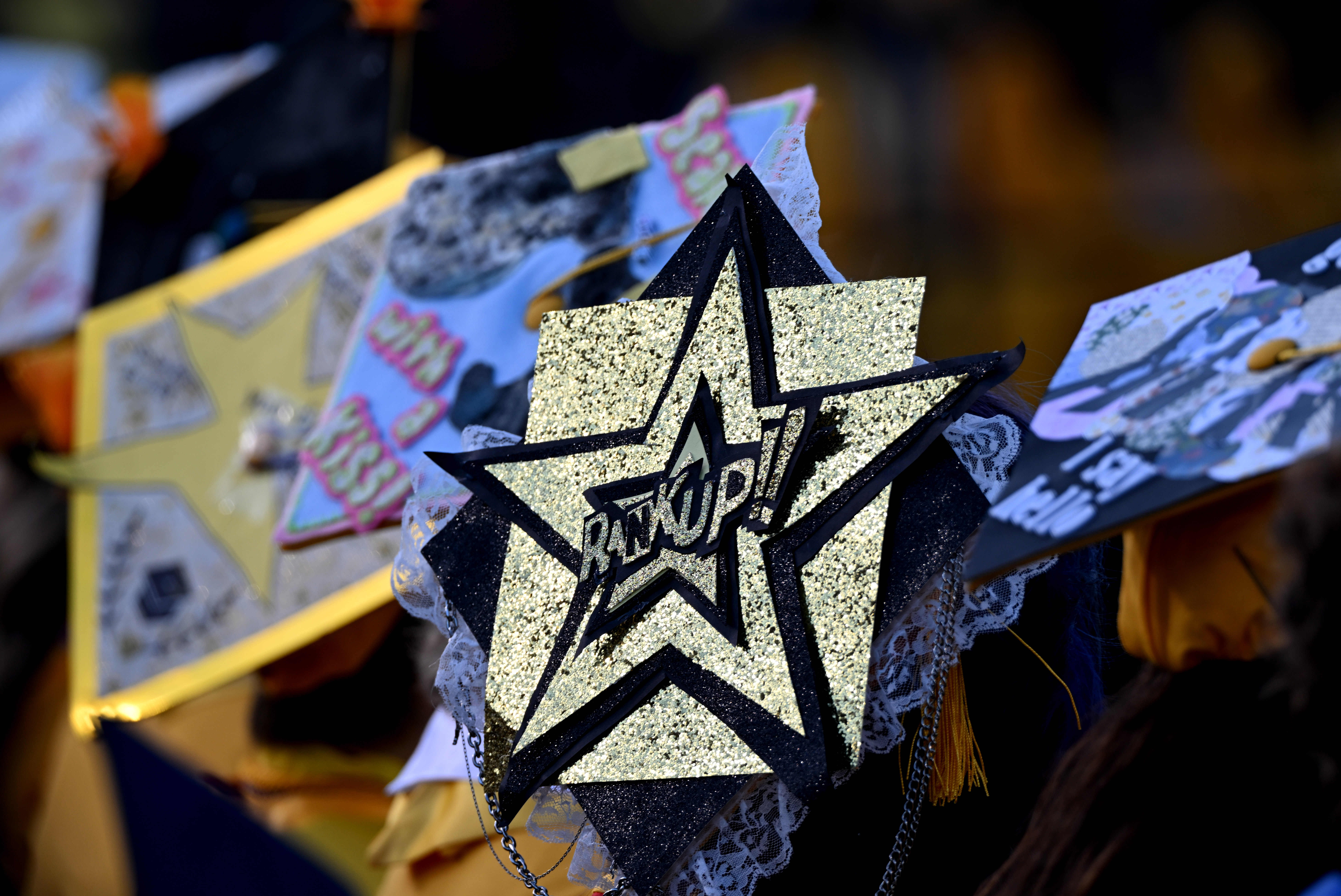 Students wear decorated mortarboards during the 2026 Millikan High School...