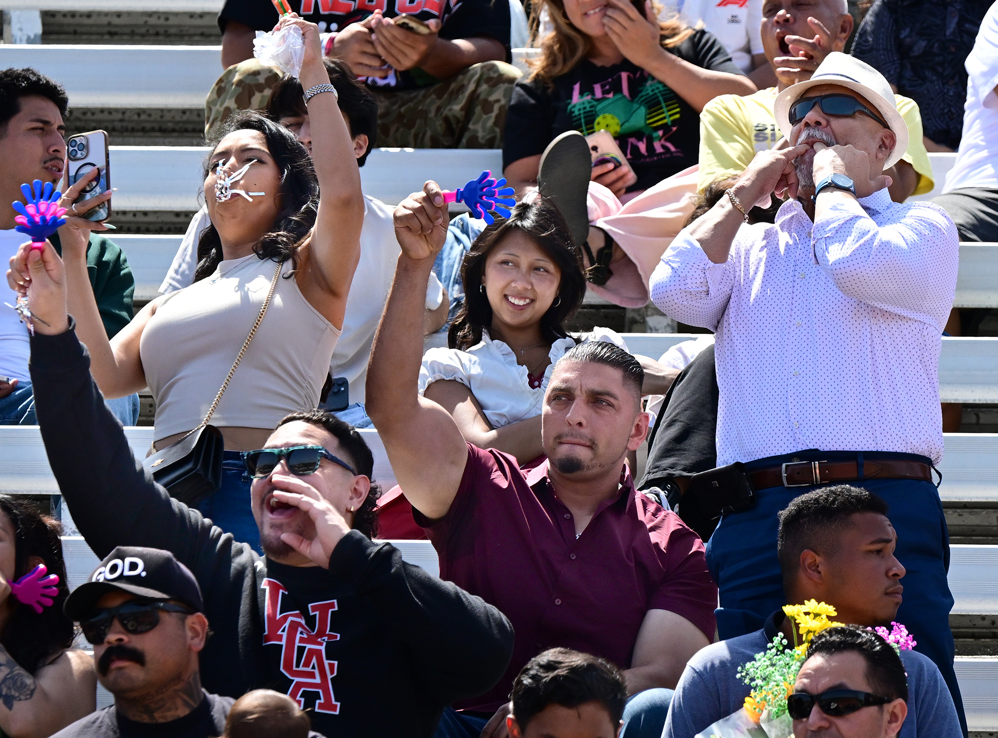 Families cheer for their kids at the Poly High School...
