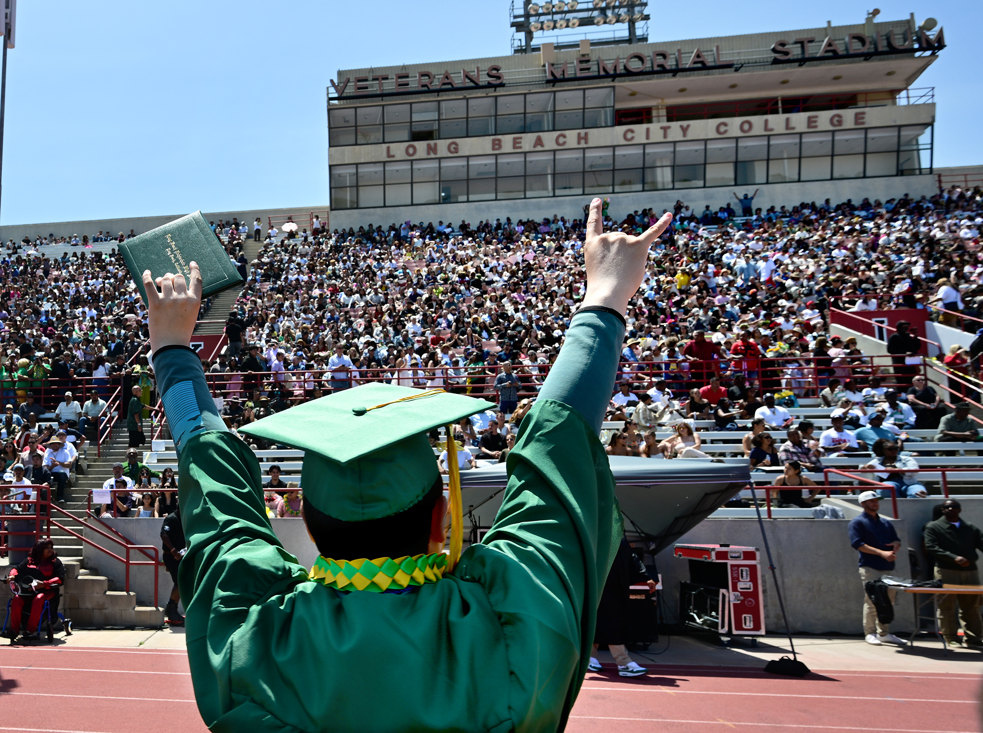Javier Guzman Valdez celebrates after receiving his diploma at the...