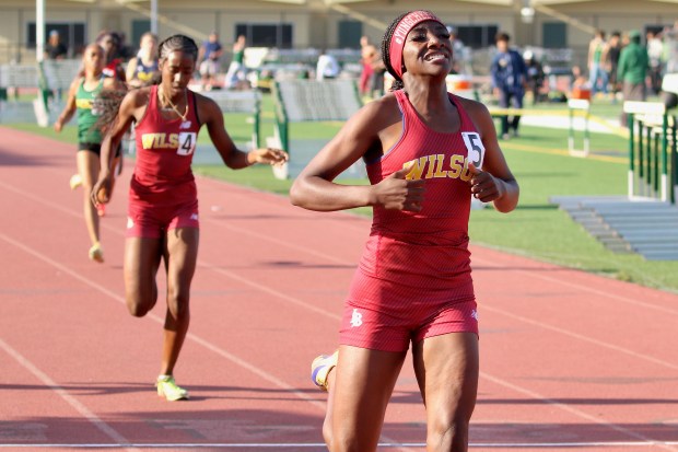Long Beach Wilson's Clara Adams wins the 400 meters at the Moore League track and field finals on Thursday, April 30, 2026, at Long Beach Poly High School in Long Beach. (Photo by Howard Freshman, Contributing Photographer)