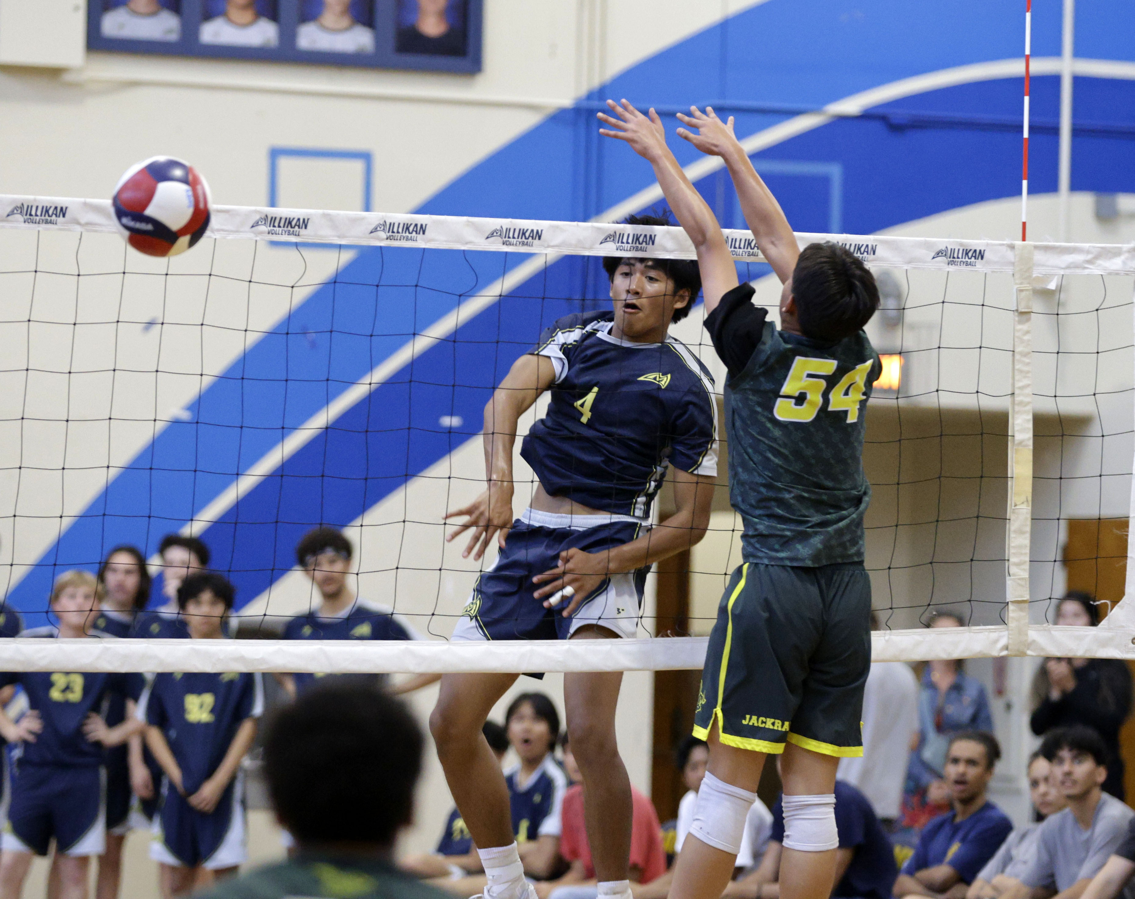 Millikan’s Kobe Magdael (4) hits the ball past Long Beach...