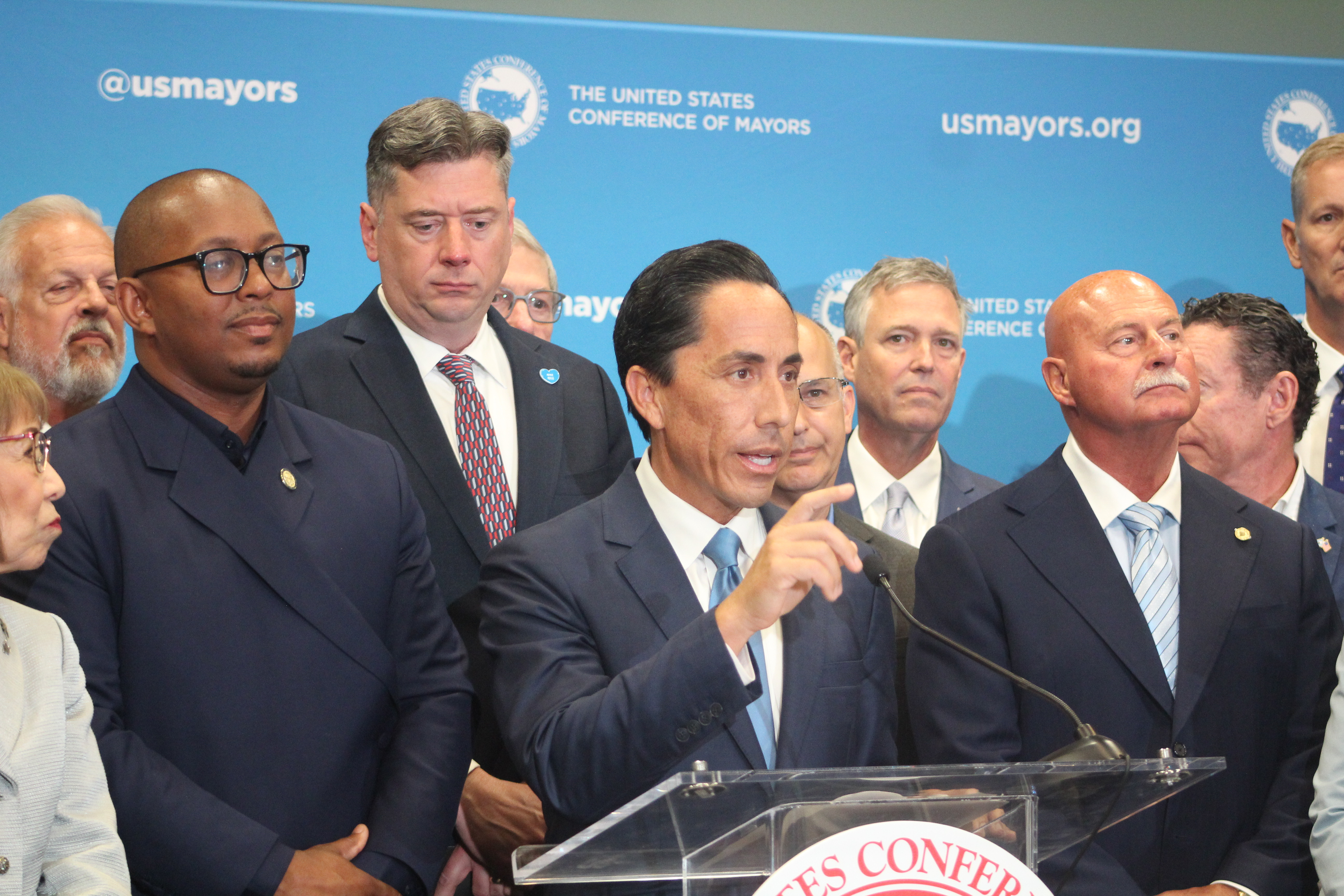 San Diego Mayor and USCM Vice President Todd Gloria (center)...