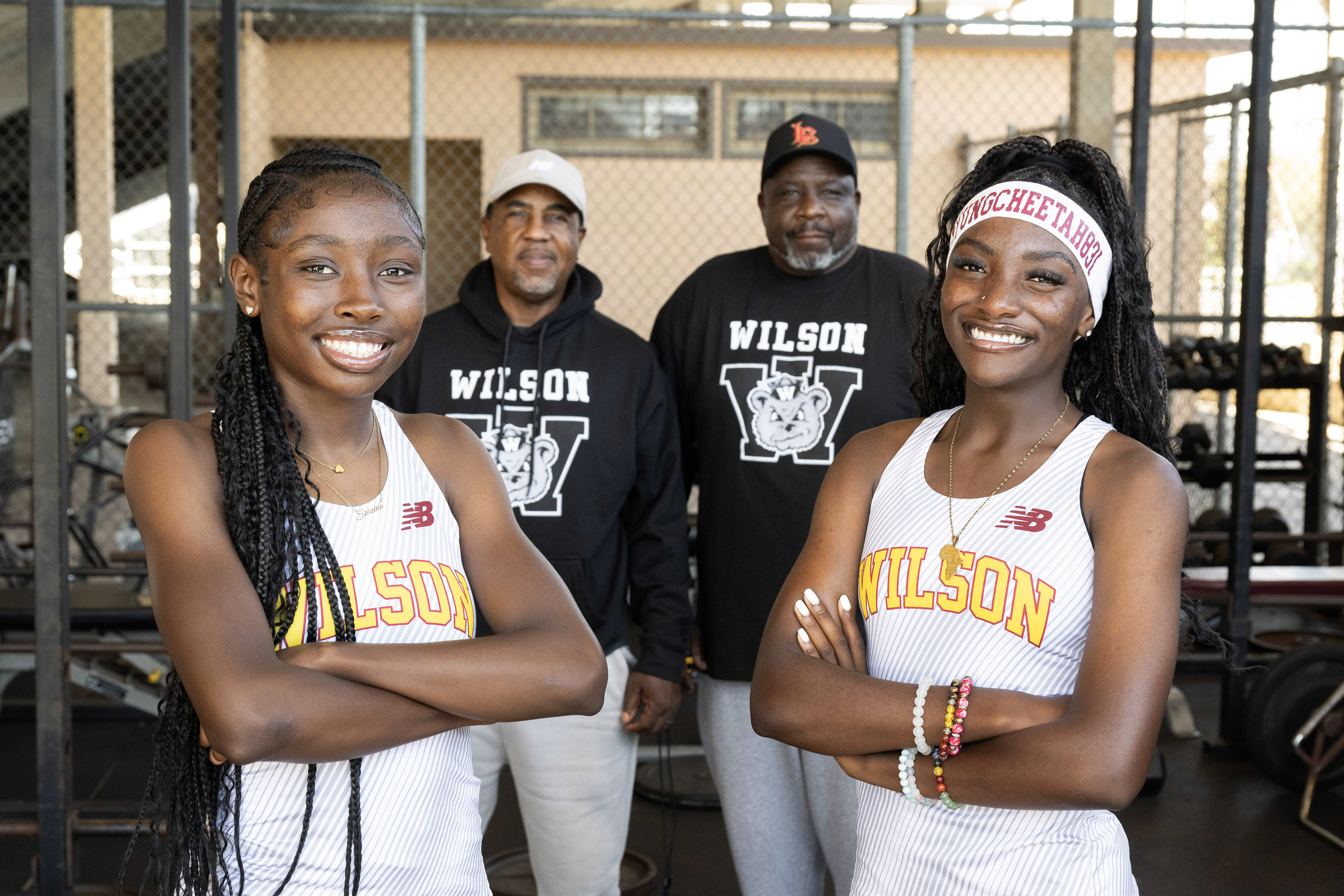From left, Saniah Varnado, Coach Neil Nelson, Coach Shannon Fisher...