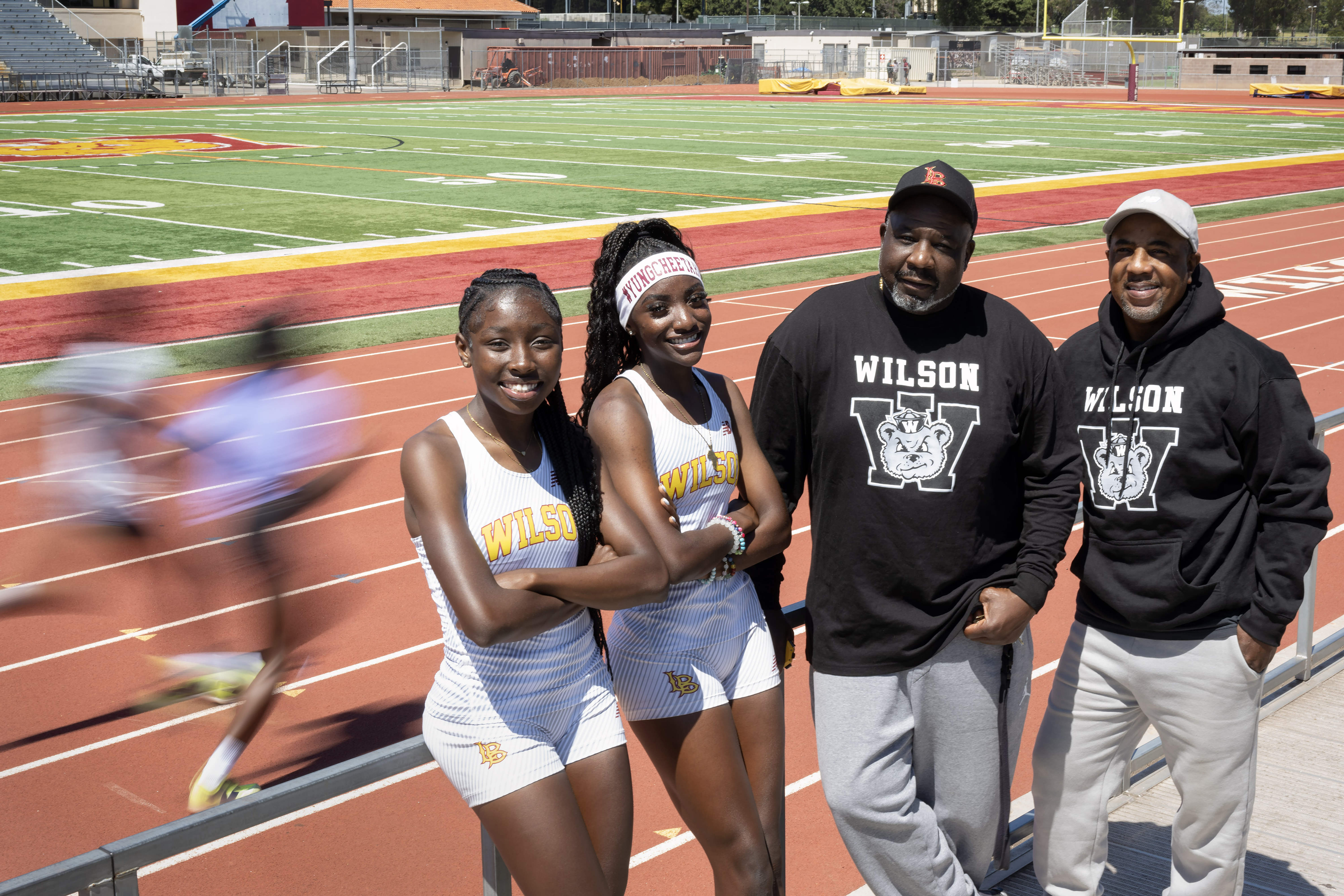 From left, Saniah Varnado, Clara Adams, Coach Shannon Fisher and...