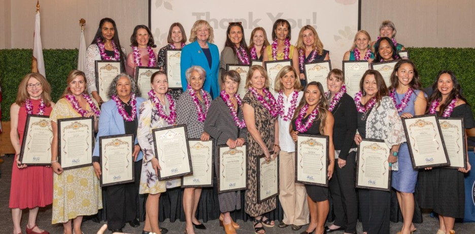 Orange County 5th District Supervisor Katrina Foley, back row, fourth...