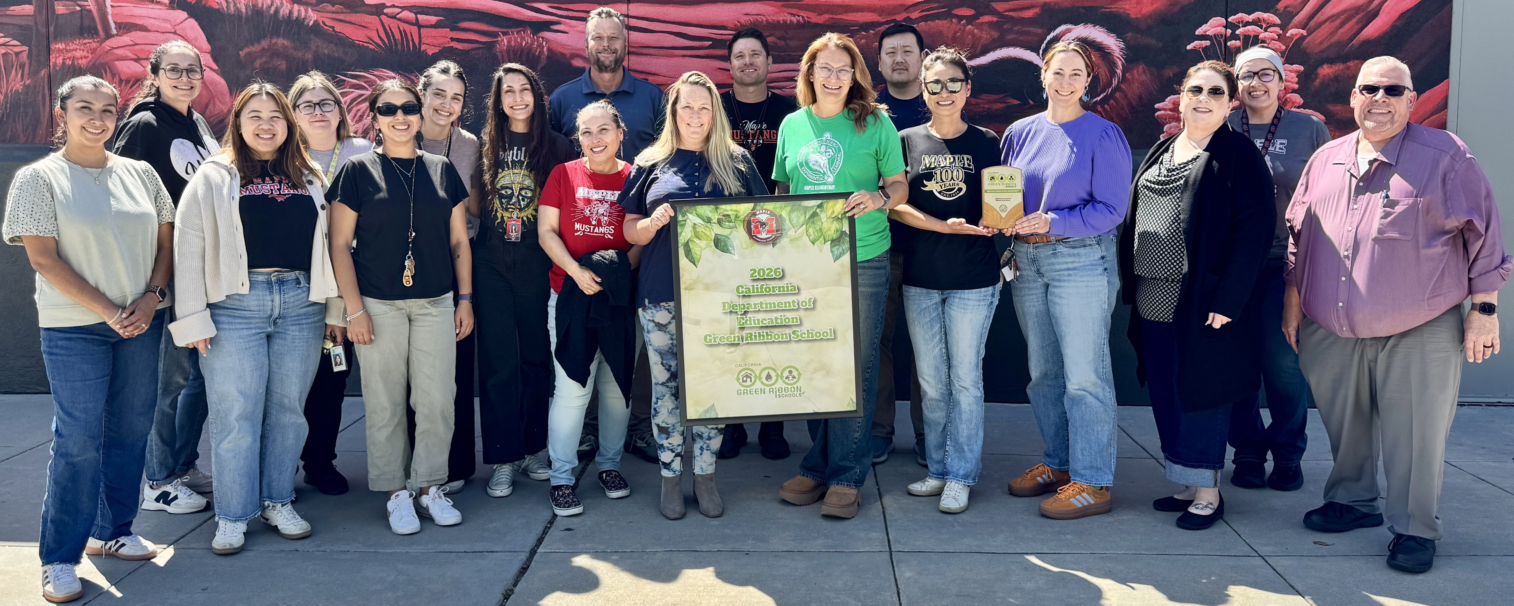 Maple Elementary School teachers, staff and administrators celebrate the schoolâs...