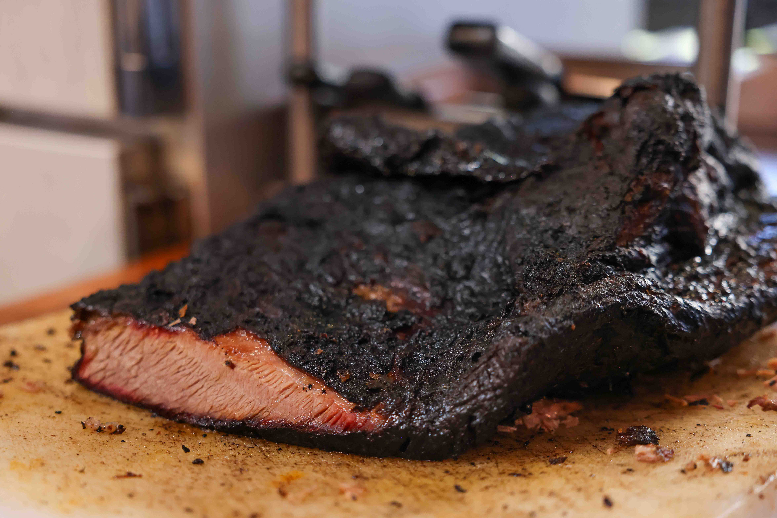 Brisket is pulled out of the oven at Everett &...