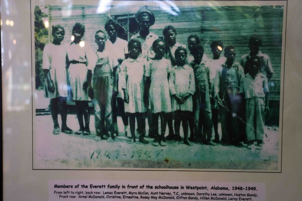 A photograph of the Everett family in front of a schoolhouse in Westpoint, Alabama, taken in the late 1940s, is displayed at Everett & Jones BBQ in Oakland, Calif., Friday, May 15, 2026. The late Dorothy Everett, the original owner of the restaurant, is pictured sixth from left in the back row. (Ray Chavez/Bay Area News Group)