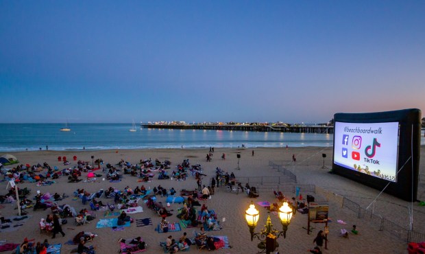 Film lovers arrive early to stake out sandy spots for the Santa Cruz Beach Boardwalk's free summer movie series. (Courtesy of the Santa Cruz Beach Boardwalk) 